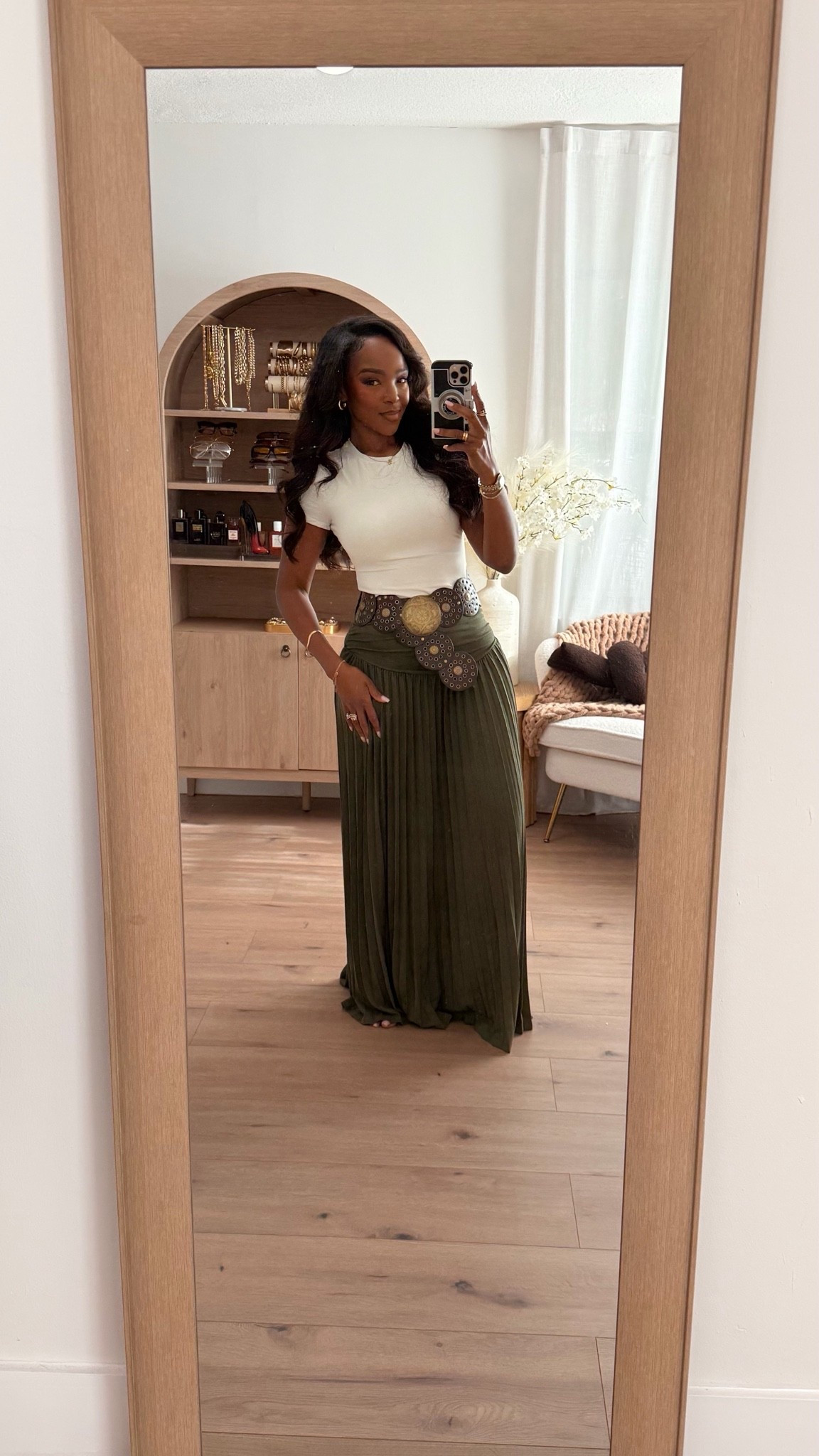 Hi Babes!

This outfit is giving effortless luxury with a touch of boho chic 🤎✨

I’m obsessed with the contrast of the fitted white tee and the flowy olive maxi skirt. The statement belt completely transforms the look and gives it that elevated designer-inspired feel. This is one of those outfits that looks expensive, comfortable, and timeless all at once.

Where to wear this:
• Winery day
• Vacation strolls
• Sunday brunch
• Outdoor events
• Casual dinner date

Undergarments: Nude seamless bra and underwear recommended.

Everything is linked below!

xx Kira | IG: KirasFashionFinds

34D - 27 - 40 • Size Small or 4