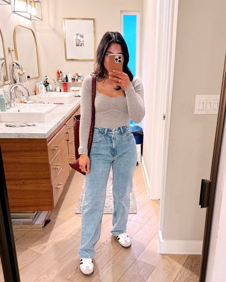 Love these high rise 90s relaxed jeans, wearing my true size in curve love style and regular length! On sale this weekend with code AFLTK! My bodysuit is also on sale wearing a small! My bag is also on sale tan color still in stock use code ANTHRO20

#LTKsalealert #LTKSpringSale #LTKitbag