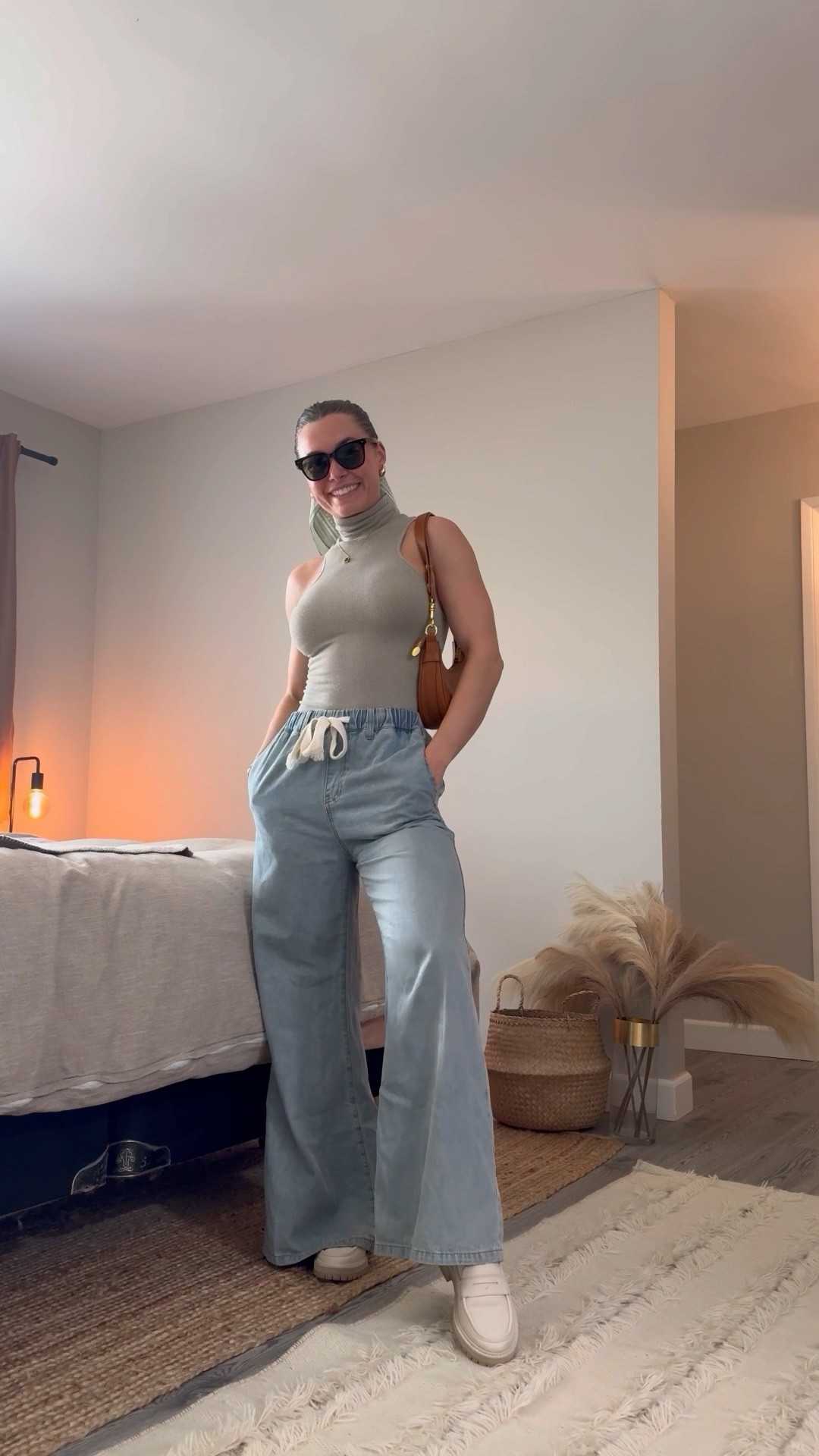 New FAVORITE top alert! 🚨  

This ‘Always Ready Seamless Turtleneck Tank’ from Free People is such a great transitional piece as we head into fall. It’s such a beautiful and feminine silhouette that is perfect for layering under a cardigan or blazer for work or with a denim or camouflage jacket to grab drinks with friends in. 

Pair it with jeans, trousers, a skirt, short, literally anything and look super chic!

P.S. This tank comes in 12 different colors!! Obsessed!

I’m wearing an XS/S (super stretchy) in the top. 
Size small in the Cider wide leg trousers.
Size 7 (true to size) in the TOMS loafers

My handbag is from Commense Clothing, but I found a duplicate that I tagged from Amazon. 

#LTKStyleTip #LTKFindsUnder50 #LTKSeasonal