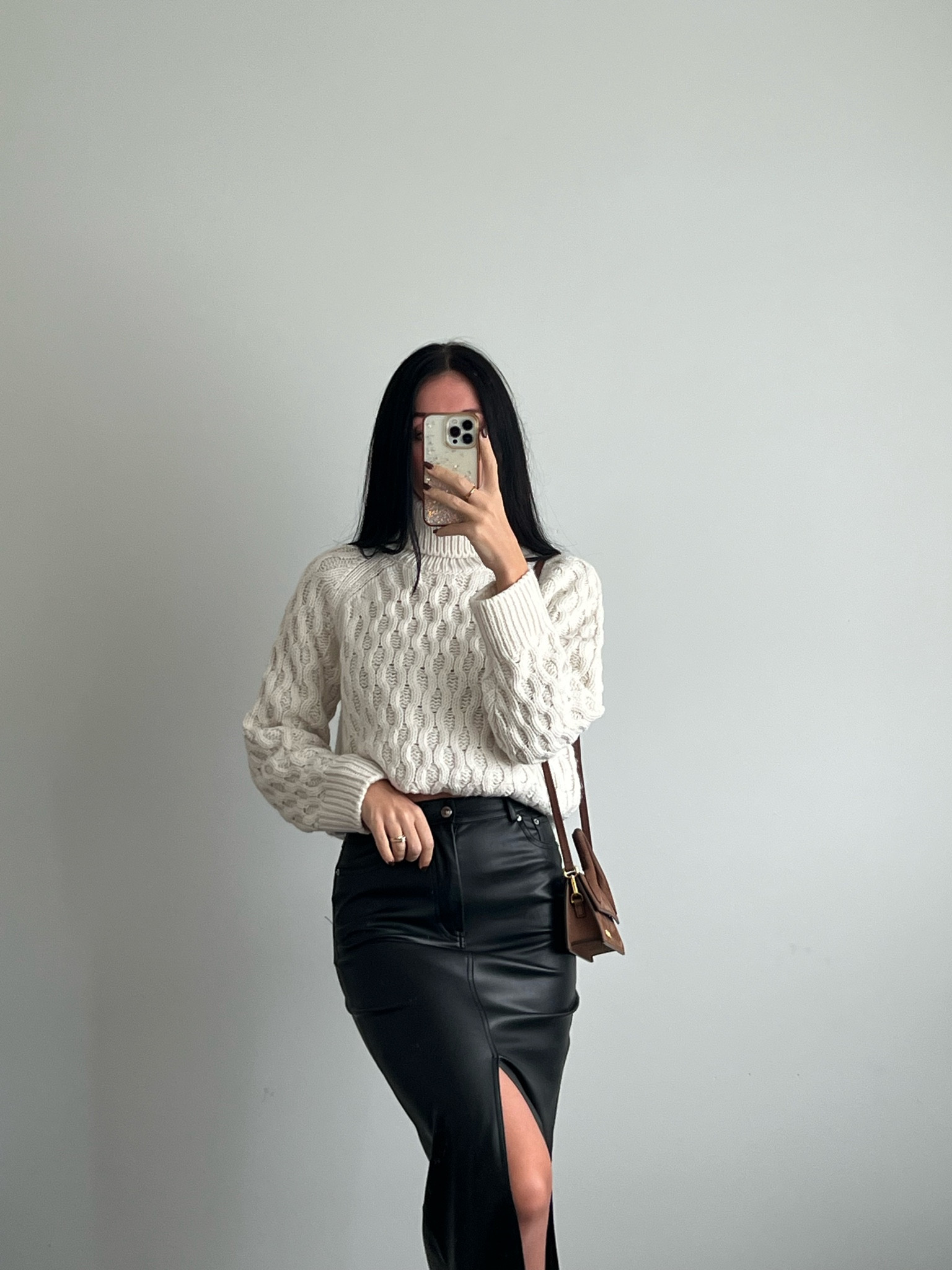 Styling this chunky H&M sweater with leather midi skirt and jacquemus brown suede mini purse. #chunkysweater #leatherskirt #winteroutfit #jacquemuspurse #whitesweater #h&msweater

#LTKGiftGuide #LTKSeasonal #LTKstyletip
