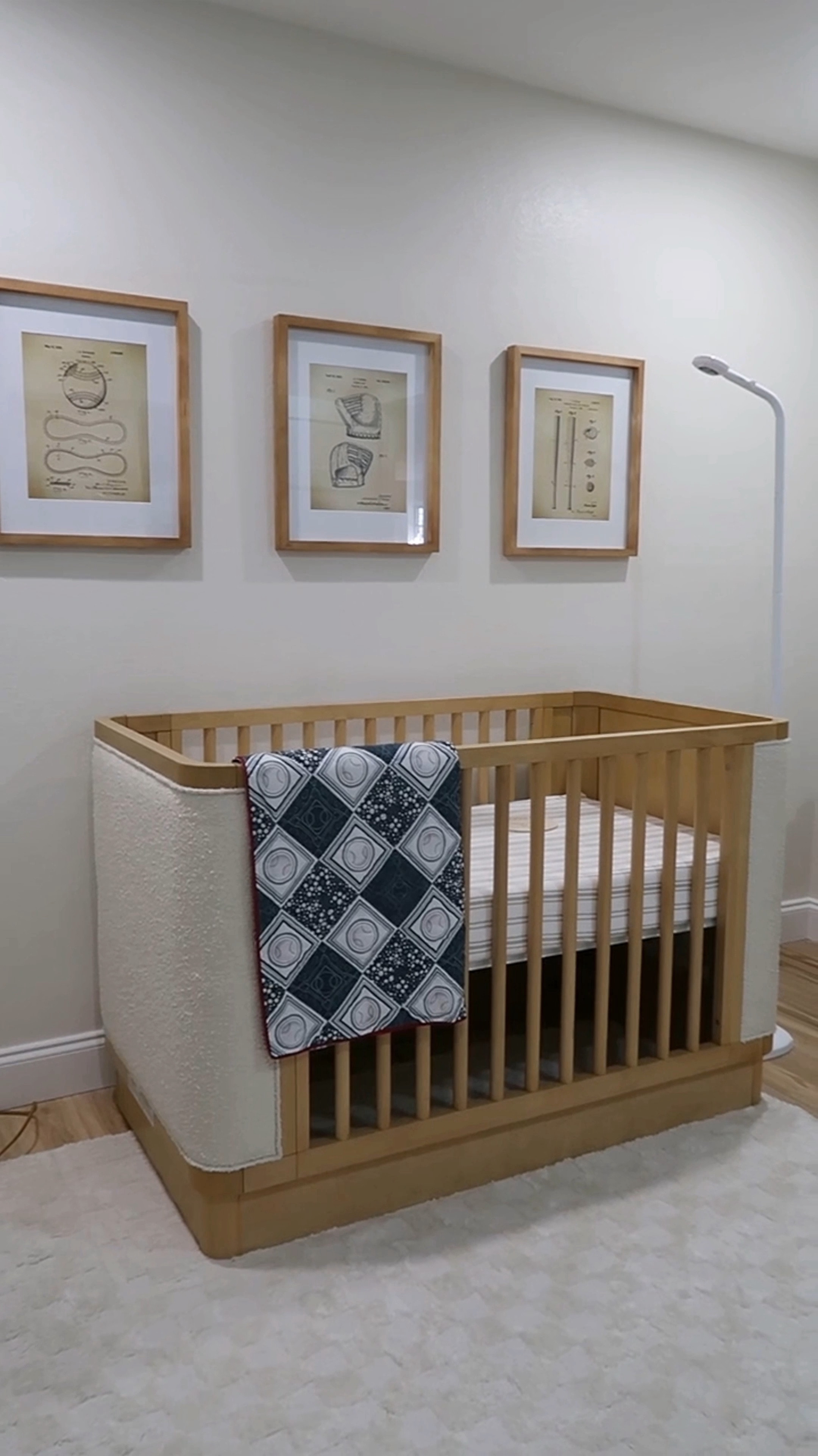 Retro baseball nursery. Boucle crib, automatic recliner, and chest of drawers changing table, hatch changing pad smart scale, retro baseball prints, coordinating natural wood framed with white matting, extra soft washable rug, Nanit floor baby monitor, custom mobile, breathable mattress, and more 

#LTKhome #LTKbaby #LTKbump