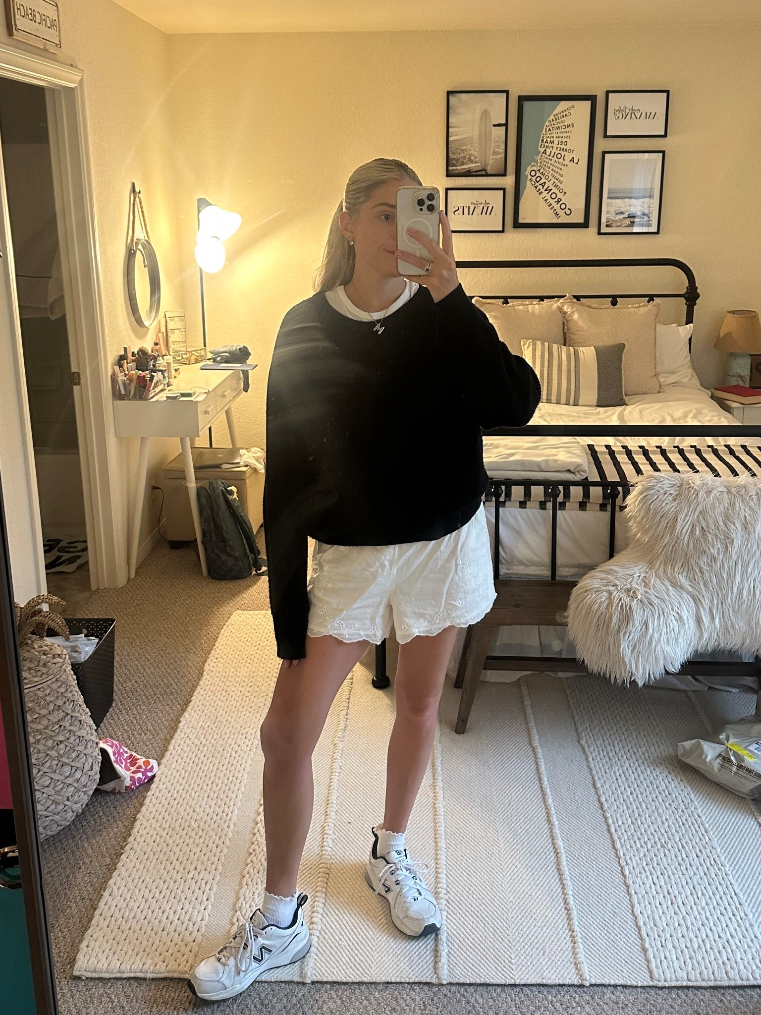 casual summer outfit inspo / white linen lace eyelet shorts, black sweater and dad shoes 