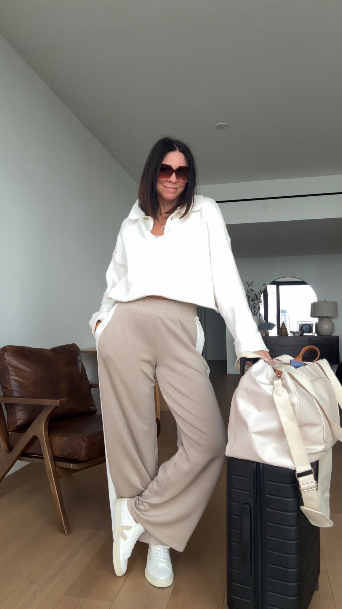 Another day, another travel fit. ✈️ 

sweater is Show Me Your Mumu (couple of seasons ago) track pants are Spanx ( and they are having doing 30% off for Black Friday- on their most popular collections - run don’t walk)  I should have gotten the long length - even tho the reg length is long enough ( I’m 5’11) these are fins sale so can’t send them back- I did get the black pair in medium, long. 
Sneakers are Veja, go-to travel bag is Beis( East to West tote) and Away  carry on. 


#LTKTravel #LTKOver40 #LTKCyberWeek