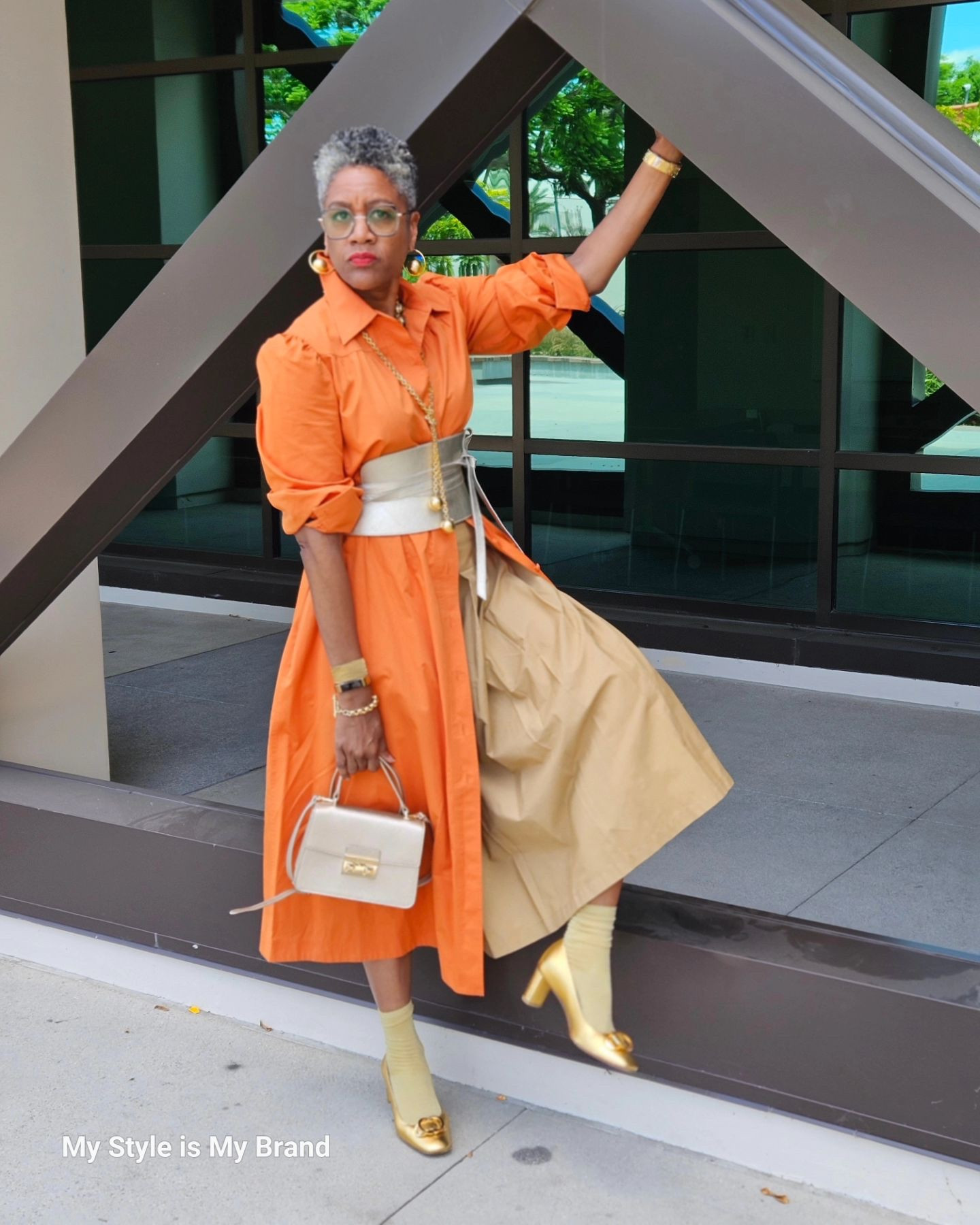 Happy Friday, y'all!

It's not a gold medal 🥇, but it shines as bright.  I don't know about you, but I'm obsessed with the Olympics. As soon as I get home or finish work, I'm scrolling through the events of the day.  Right now, I'm watching Freestyle BMX...but I'm ready, ready for track & Field.

I'm inspired by folks who have trained their whole lives to compete in an event that lasts less than one minute, in some cases. The dedication, focus and commitment are 🤯.

The fit is a dress over skirt moment that I felt great in. The 🧦 received a lot of love today. I love people loving socks.

Dres (old): Tory Burch @toryburch 
Skirt: Target 
Belt: Pritch London @pritchlondon (influenced by Gina @ginamkstyle)
Socks: Amazon (linked in my storefront)
Shoes: Stuart Weitzman @stuartweitzman 
Bag: Furla @furla 
Earrings and Necklaces: Ermine NY @erminenewyork 
Glasses: Zeelool @zelool (discount code SABRA)