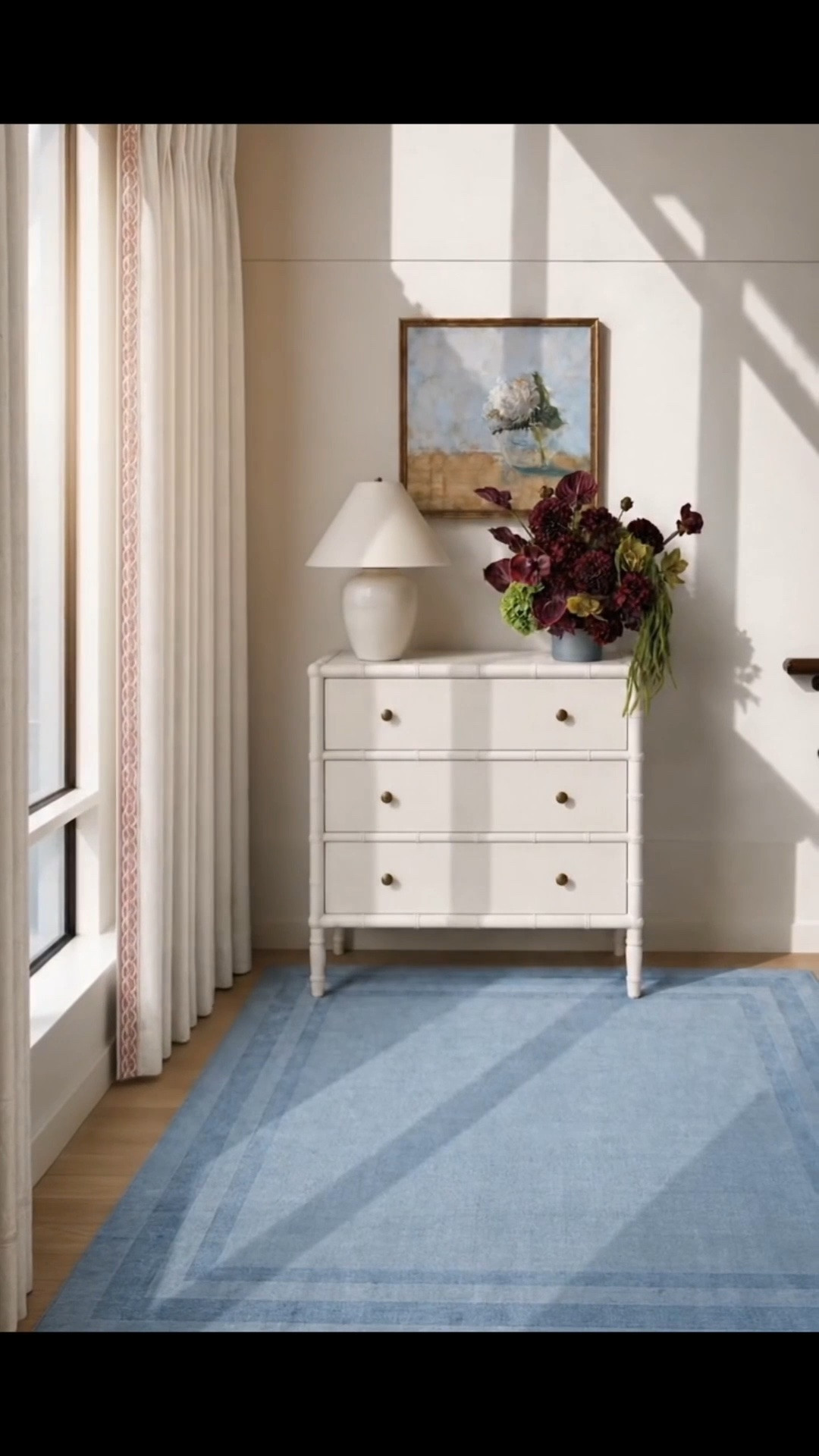 need to copy and post. I’m sorry.

Monday morning, with soft sunshine and a fresh start for the season. ✨ White linen French-pleated drapes give this stair landing a tailored feel, while burgundy flowers bring in the richness of early fall. The blue rug keeps it relaxed and balanced.

I love the three-drawer chest here: bamboo-inspired detailing and brass hardware make it beautiful, and the generous drawers make it practical. It would work just as well in an entryway, hallway, or bedroom.

Serena & Lily’s Fall Design Event is on now: 20% off everything, or 25% off plus free shipping when you spend $2,500.

#MondayMorning #MondayMood #SerenaAndLily #FallDesignEvent #SerenaAndLilySale #ThreeDrawerChest #StorageChest #StairLanding #LandingDecor #EntrywayDecor #HallwayDecor #Artwork #WallArt #LinenDrapes #FrenchPleatDrapes #WindowTreatments #FloralArrangement #BurgundyFlowers #AreaRug #BlueRug #CoastalChic #ModernClassic #TransitionalDecor #SeasonalRefresh #HomeRefresh #LTKHome #LTKdayinmylife #LTKSaleAlert

#LTKdayinmylife #LTKHome #LTKSaleAlert