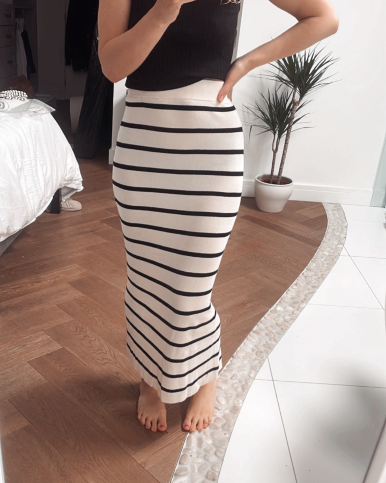 Ankle-length, fitted stripey skirt in a soft rib knit featuring a high waist with covered elastication and a slit at the back of the hem.

#LTKuk #LTKworkwear #LTKsummer