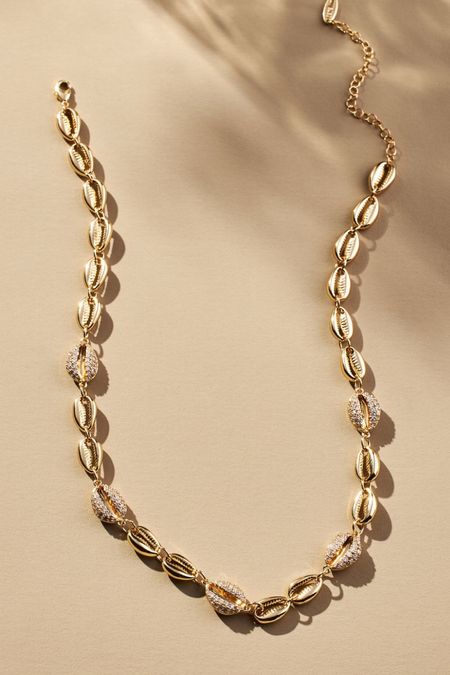 Pave Cowrie Shell necklace 
14k gold-plated brass, cubic zirconia

#LTKParties #LTKSwim #LTKStyleTip