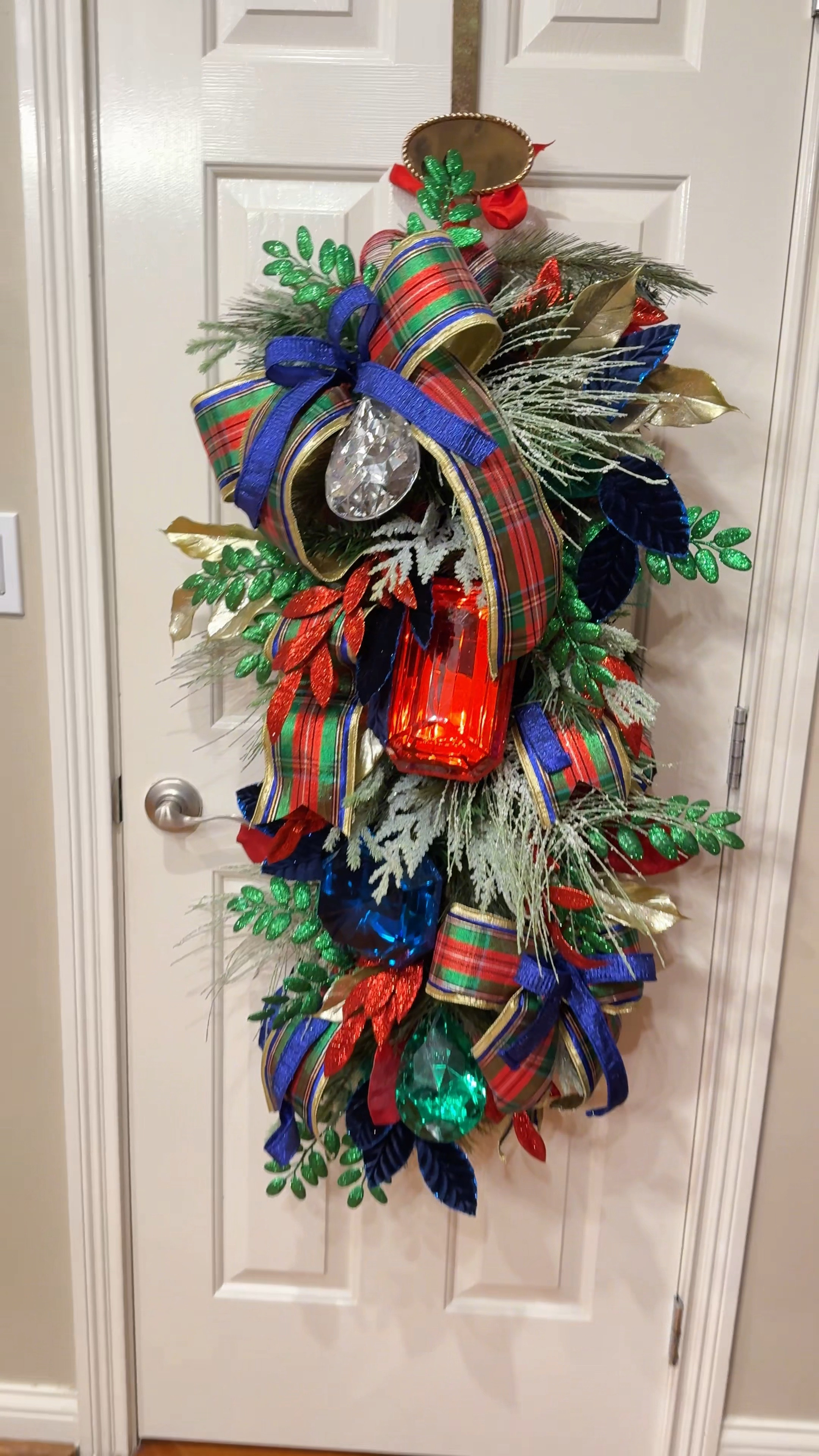 Over the top Christmas wreath teardrop in nutcracker colors for front door. Gems, glitter, and premium ribbon

#LTKHome #LTKSeasonal #LTKHoliday