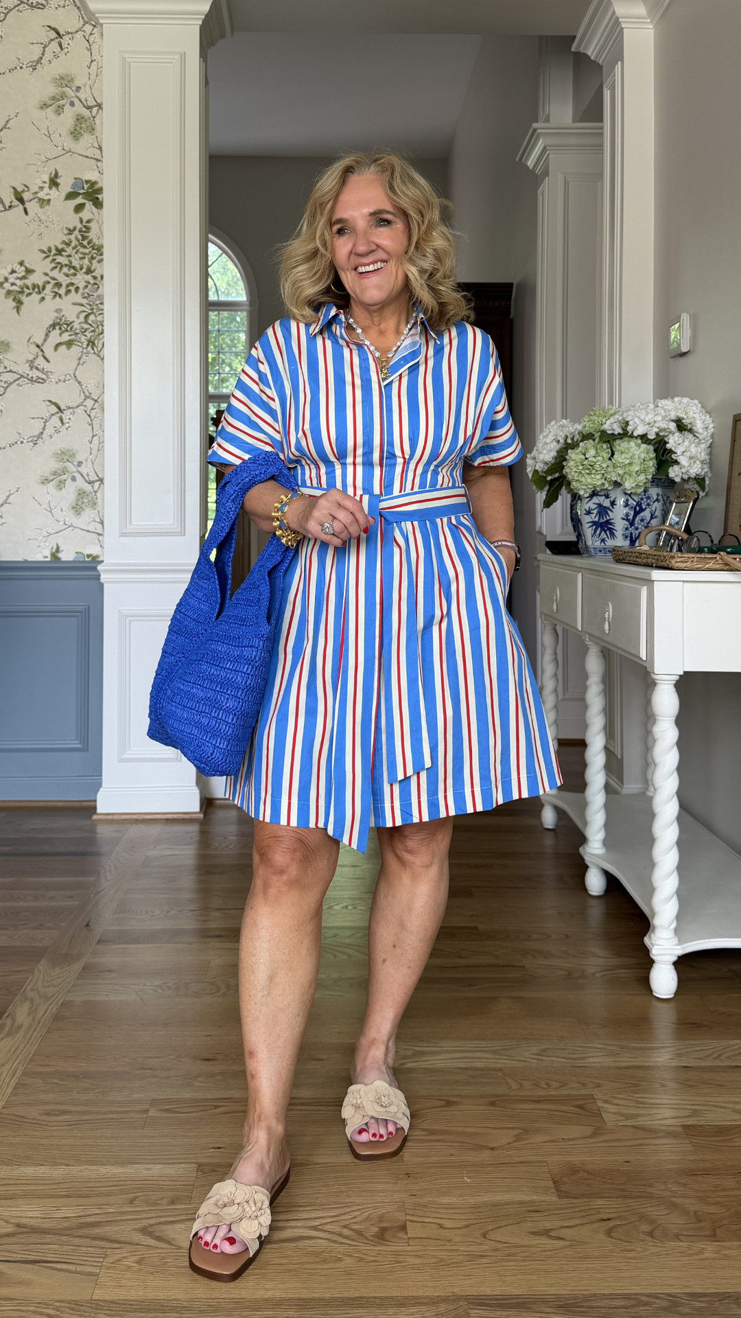 I love the classic stripe pattern with touches of red, white, and blue, it feels festive without being over the top. The shirt dress style is easy to wear, and the matching belt helps create a flattering shape while still keeping things comfortable. 🫶🏻 

 #LTKootd #LTKSeasonal #LTKOver40