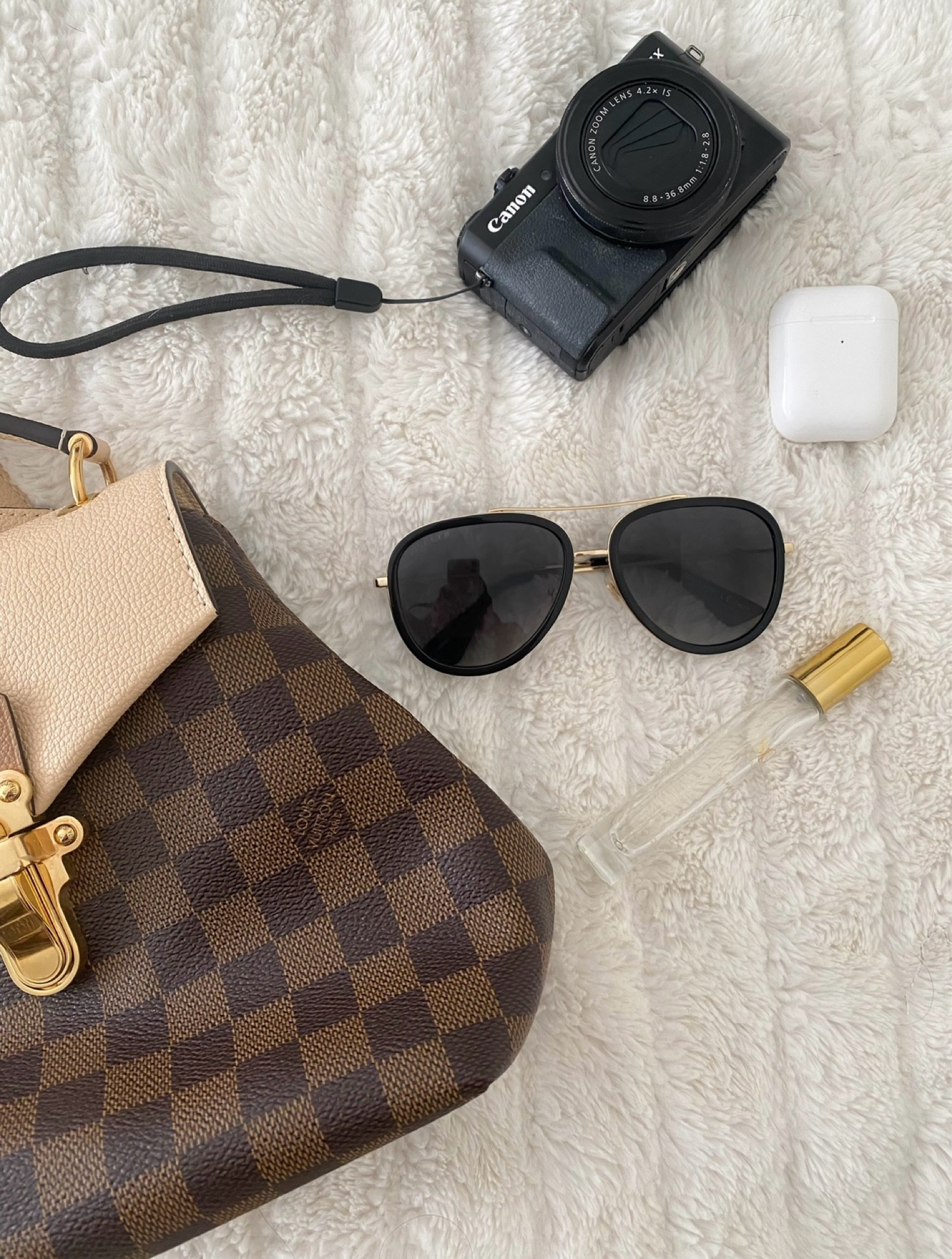 Louis Vuitton Clapton Backpack 
Gucci Aviator Sunglasses 
Travel perfume 
Baccarat Rouge 540

#LTKStyleTip #LTKTravel #LTKItBag