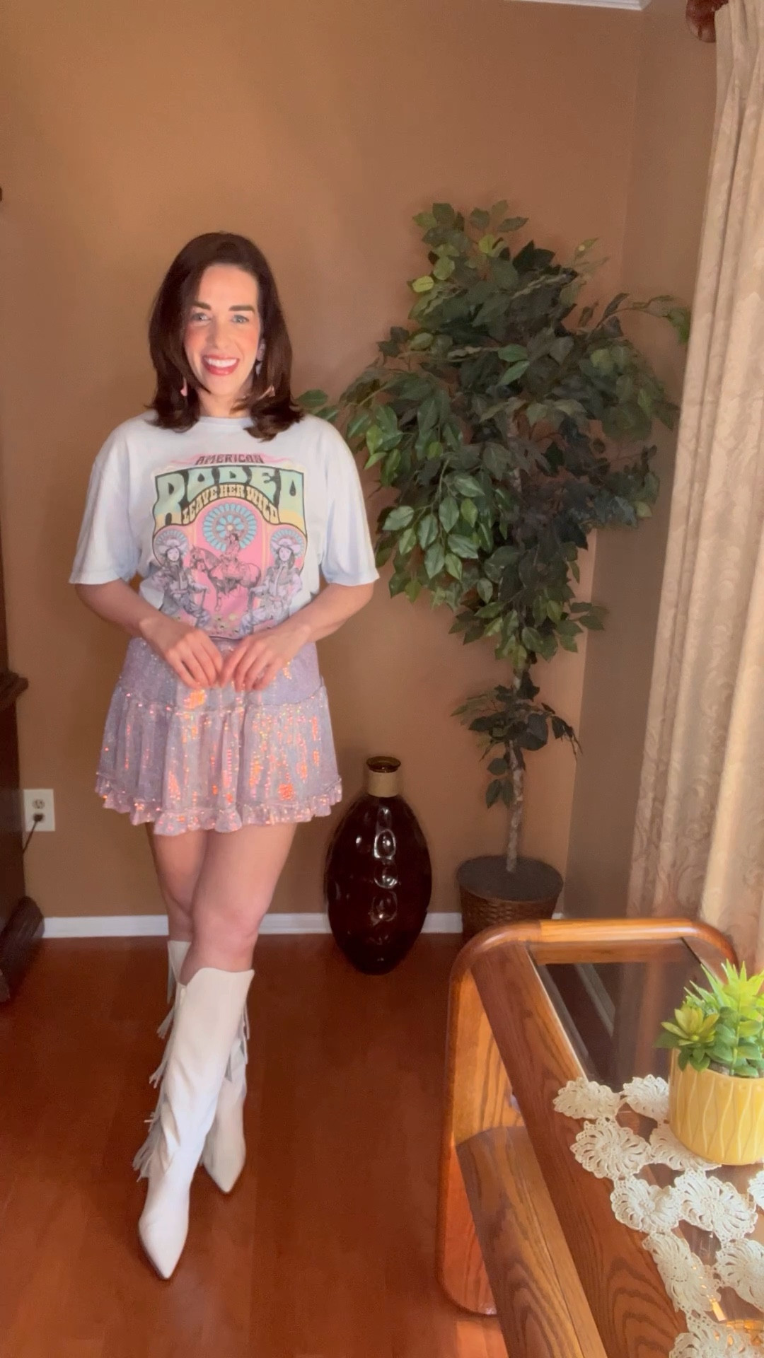 Country Concert Outfit - Rodeo graphic t-shirt (size small). Pink sequin mini skirt (size small). White fringe boots (size 8.5). Bralette (size medium). #countryconcert #countryconcertoutfit #graphictee #tee #tshirt #graphictshirt #skirt #miniskirt #pinkskirt #sequinskirt #boots #fringeboots #whiteboots #whitefringeboots #bralette 
Nashville Outfit 

#LTKSeasonal #LTKFindsUnder100 #LTKStyleTip