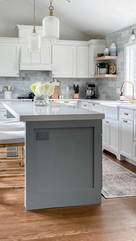 Coastal style kitchen with brass fixtures, Serena and Lily barstools, light fixtures, white cabinets, gold handles, kitchen accessories, home decor

#LTKFamily #LTKHome
