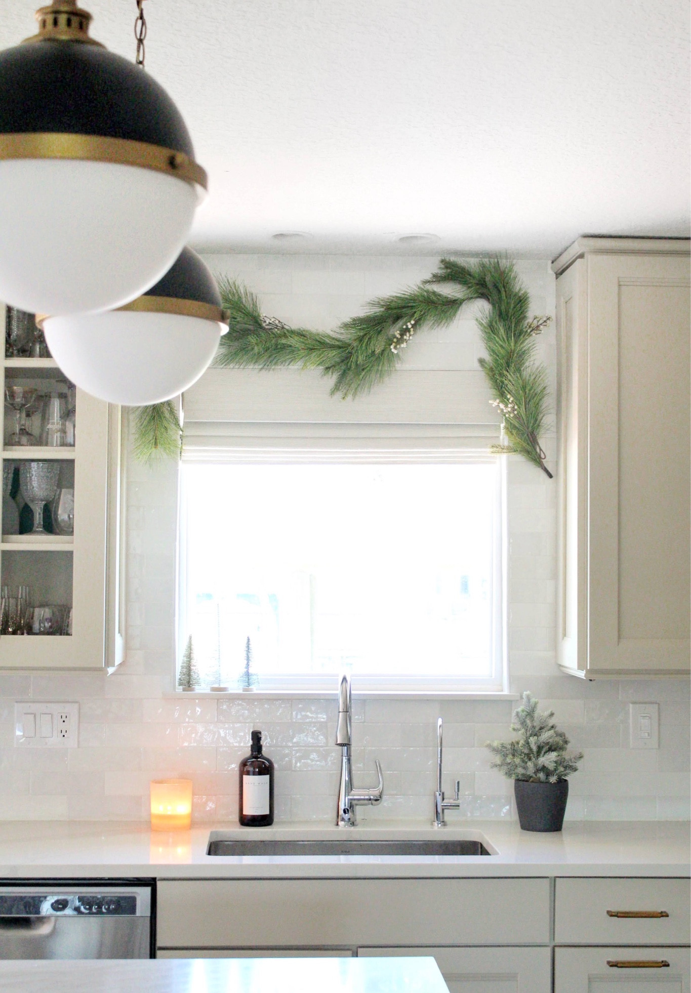 Simple kitchen Christmas decor
Green garland
Realistic garland 
Nautical pendant lights
Coastal island lighting 
Kitchen countertops 
Touchless faucet 

#LTKHoliday #LTKsalealert #LTKhome