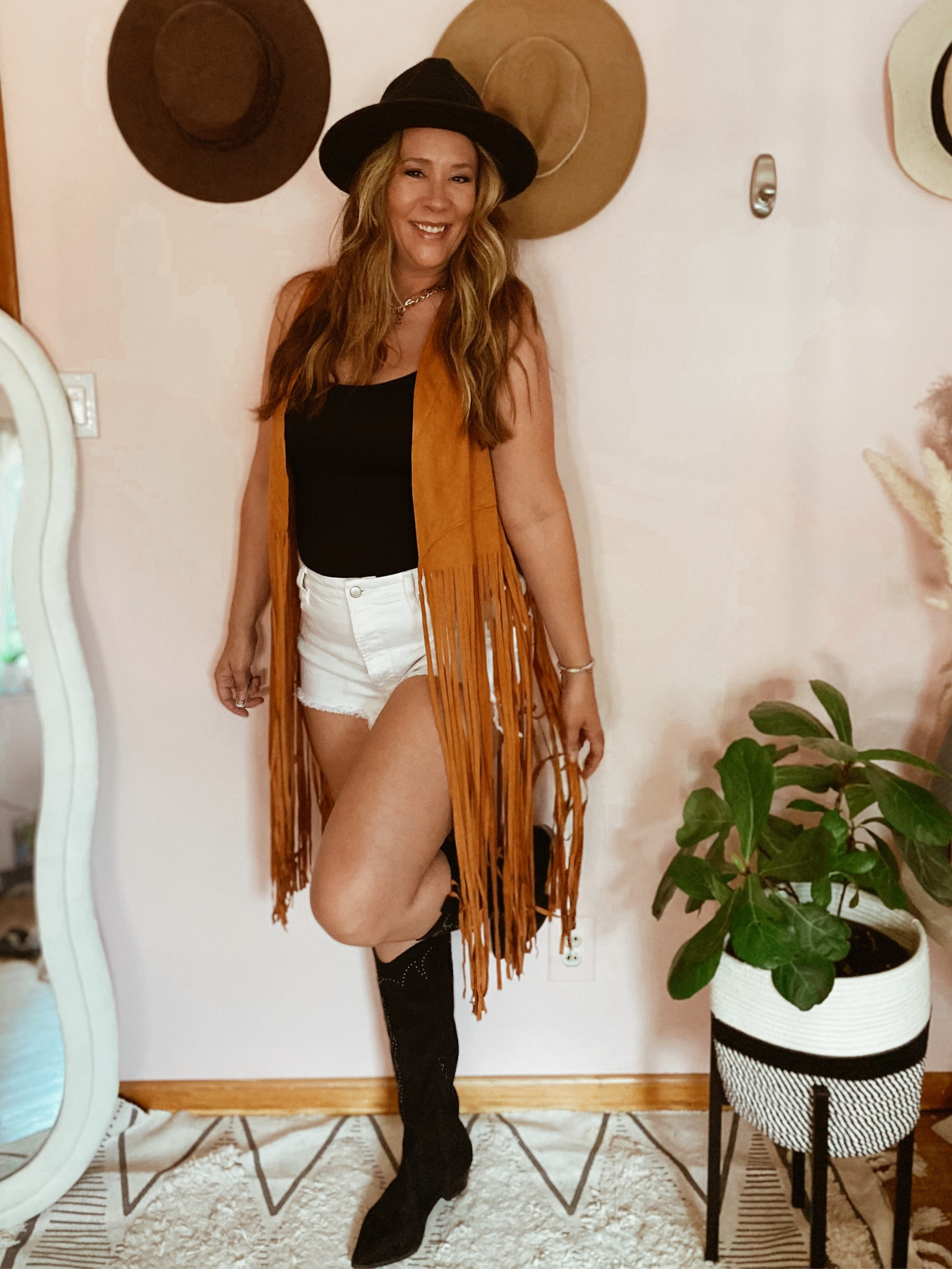 Cute country concert outfit idea! Fringe vest, cut off shorts, Nashville outfit, rodeo outfit  

#LTKunder50 #LTKstyletip #LTKFind