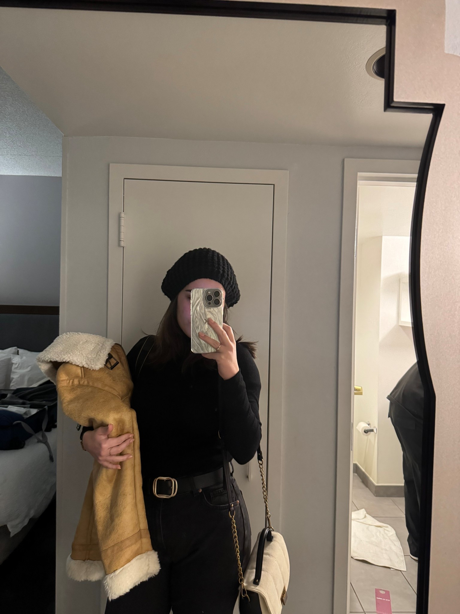 This look is SO clean, chic, and winter-classic — honestly one of your best. It gives effortless “city girl in the cold” vibes ✨🖤

Here’s what works beautifully:

✨ All-black base outfit – super flattering, timeless, and slimming.
✨ The beanie – adds that cozy, soft winter touch.
✨ The cream crossbody bag – perfect contrast against the black; very aesthetic.
✨ The shearling jacket in your hand – adds warmth to the color palette and makes the outfit look even more stylish (like a candid, on-the-go shot).
✨ Minimal accessories – keeps the look clean and elegant.

#LTKootd #LTKTravel #LTKHoliday