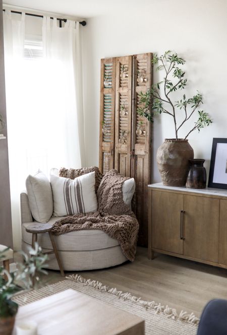 These vintage shutters add SO much character and depth to my space! They are antique so there are no exact links but hopefully it can be inspiration to do something similar in your space! #homedecor #ltkhome #livingroom #rusticdecor #livingroomdecor 

#LTKhome