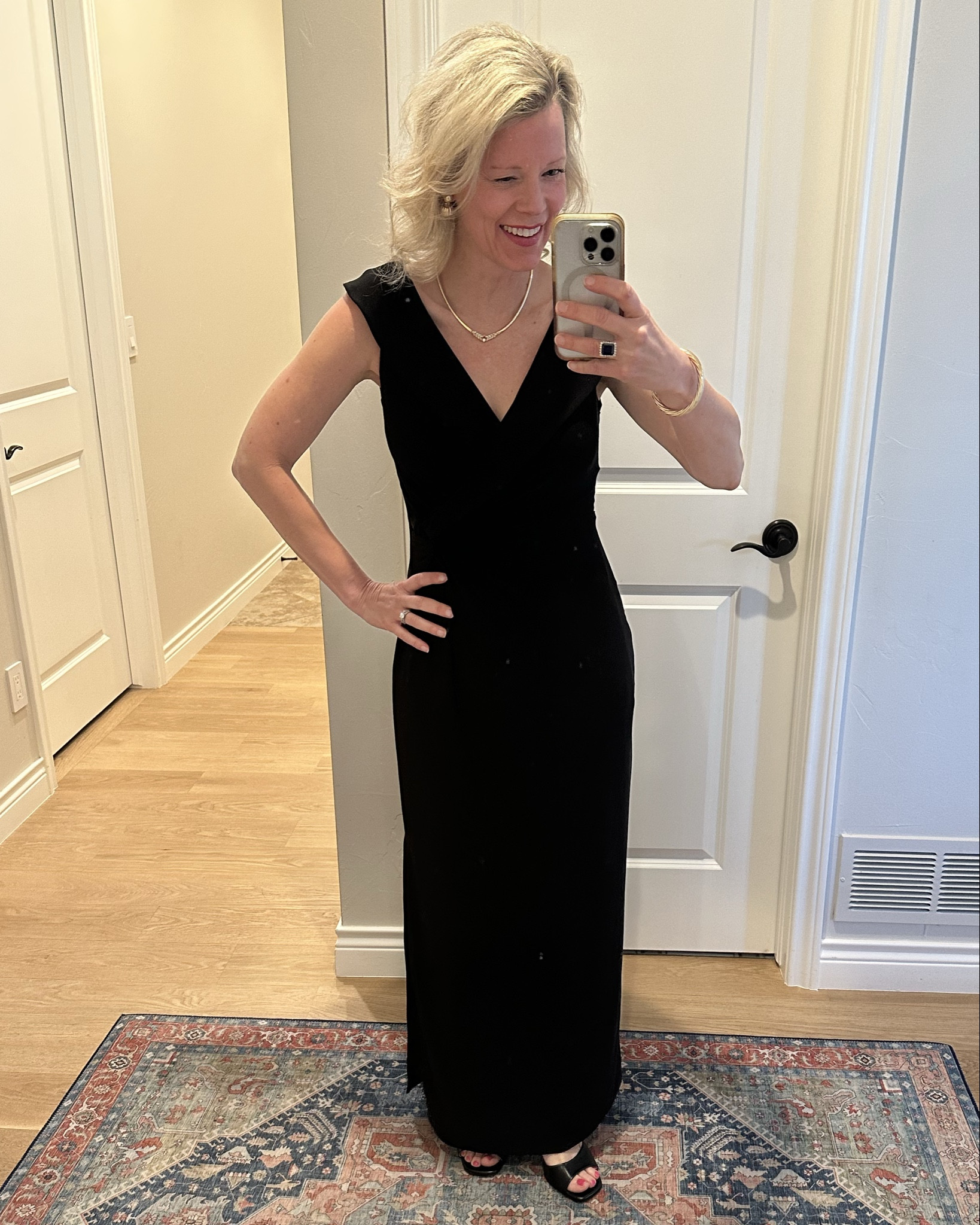 Such a classic and beautiful black dress!!  It’s perfect for a wedding guest dress or formal event  I borrowed this from a friend who got it hemmed. I’m wearing my usual size 4. It is so pretty and flattering. Also comes in a navy blue. I’m carrying a fun little gold bag with it!

#LTKWatchNow #LTKWedding #LTKParties