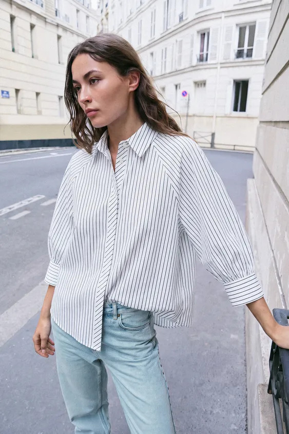 Shirt with a regular collar and puff sleeves falling below the elbow. Featuring a front button fa... | Zara IT