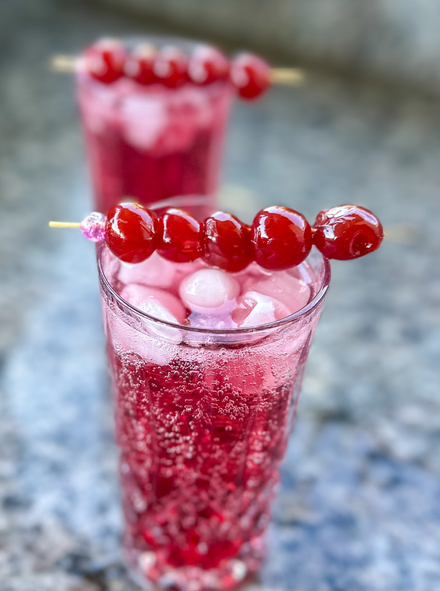 Cheery Cherry mocktail in these tall glasses. Perfect for the holidays. #glassware #drinks #cherrymocktails #foodie 