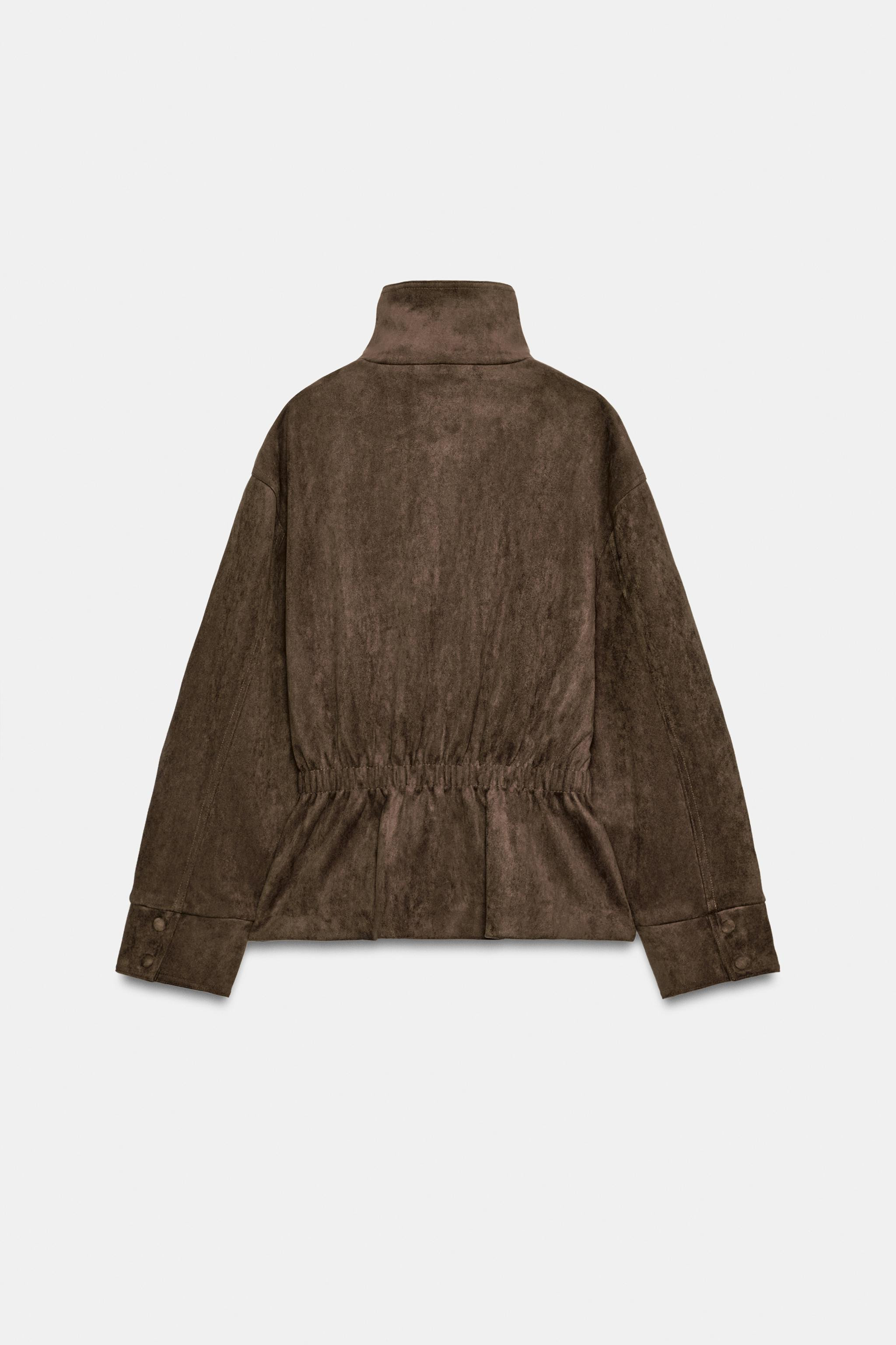 Jacket with a high collar and long sleeves. Front pockets. Featuring a matching fabric belt and g... | Zara UK