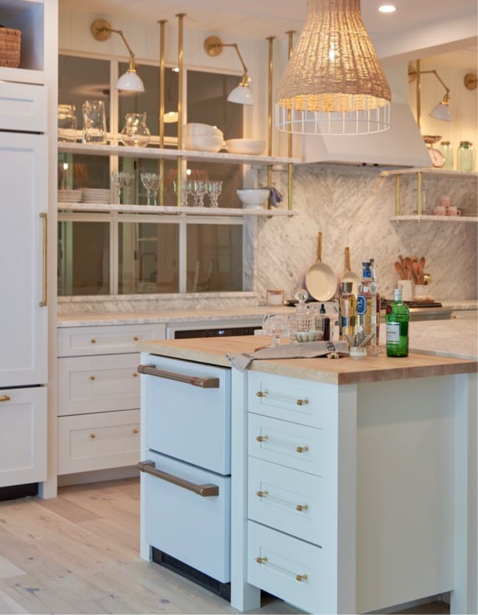 Marble backsplash and shelving adds an elegant and contemporary touch to this utilitarian kitchen! 

#LTKfamily #LTKhome #LTKFind