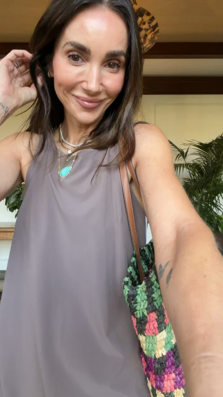 This taupe maxi dress has a relaxed column shape that skims instead of clinging, and the white contrast piping gives the simple silhouette a more finished look. The side slits keep it easy to walk in, while the neutral color works with flat sandals, layered jewelry, and a colorful tote for dinner or vacation.

taupe maxi dress, contrast trim dress, sleeveless maxi dress, side slit dress, neutral summer outfit, vacation dinner outfit, resort wear, relaxed fit dress, summer maxi dress, flat sandals outfit, annabrstyle

#LTKootd #LTKActive #LTKSeasonal