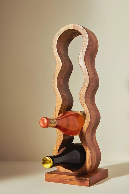 Handcarved from acacia wood, this wavy wine rack showcases your curated wine collection and lends an artistic touch to your kitchen or bar space! 

Boho vibes🫶🏻 

#LTKFind #LTKhome #LTKunder100
