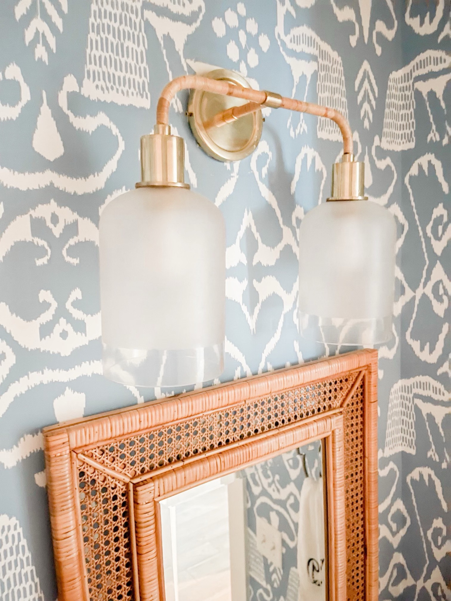 Bathroom details, powder bath, double sconce, wall, scones, rattan, mirror, rattan, and Cain mirror, natural elements, beach house, beach house bathroom, powder bath 

#LTKhome