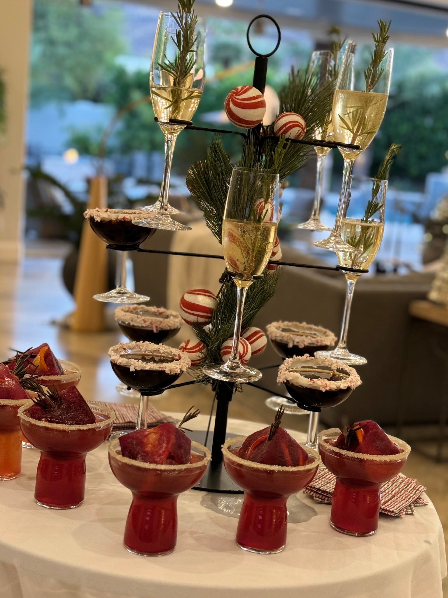 Got asked about this cocktail stand a BUNCH last night! Not expensive, can disassemble for smaller storage and a really fun focal point for a home hosted party. We use champagne or coupe glasses in it  