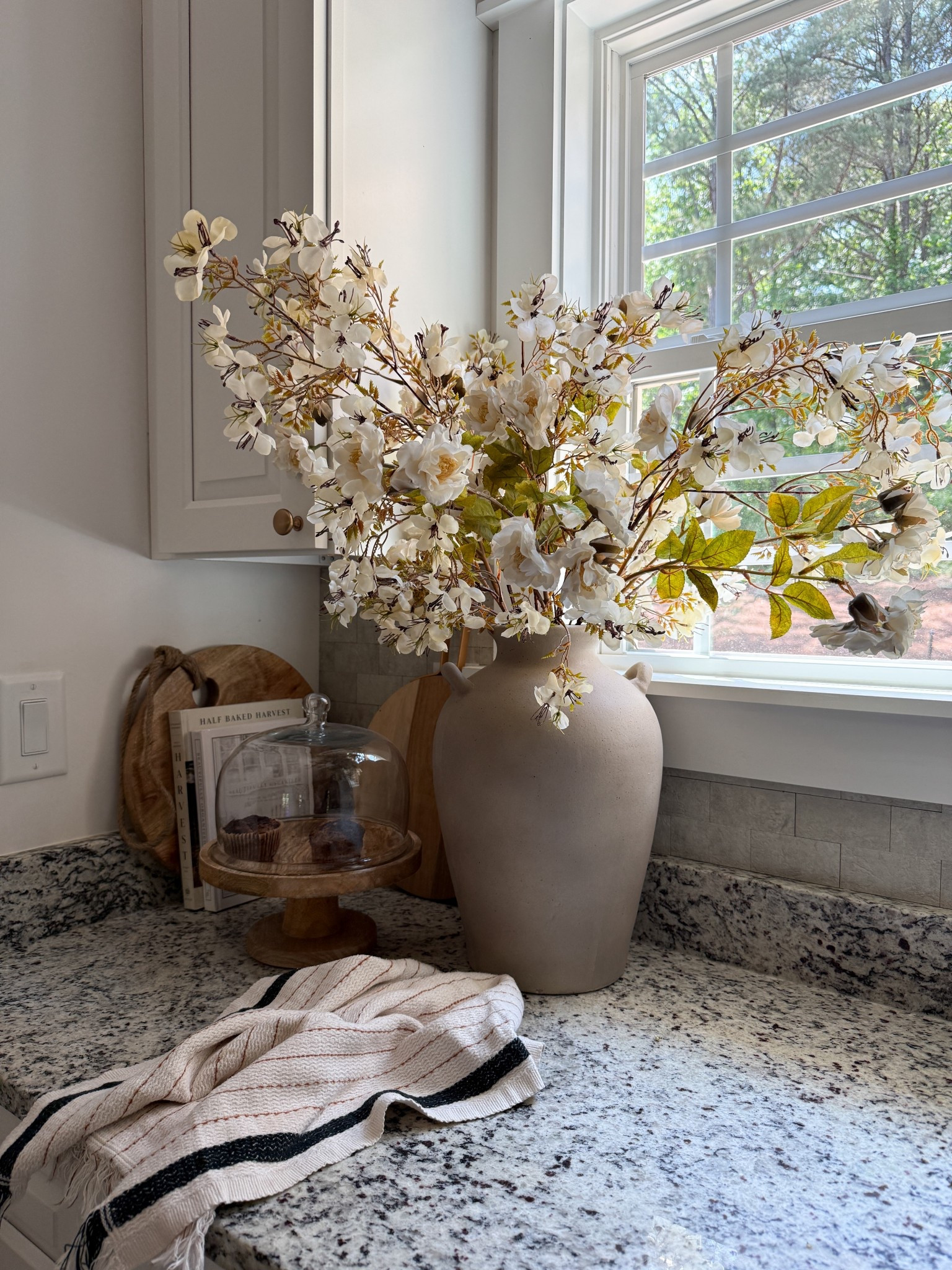 These prunus blossoms and rose sprays mixed together are such a pretty spring look for our kitchen! I’m using 3 of each in one of my favorite earthy vases!!  

@Bloomist #ad 

#LTKSeasonal #LTKHome