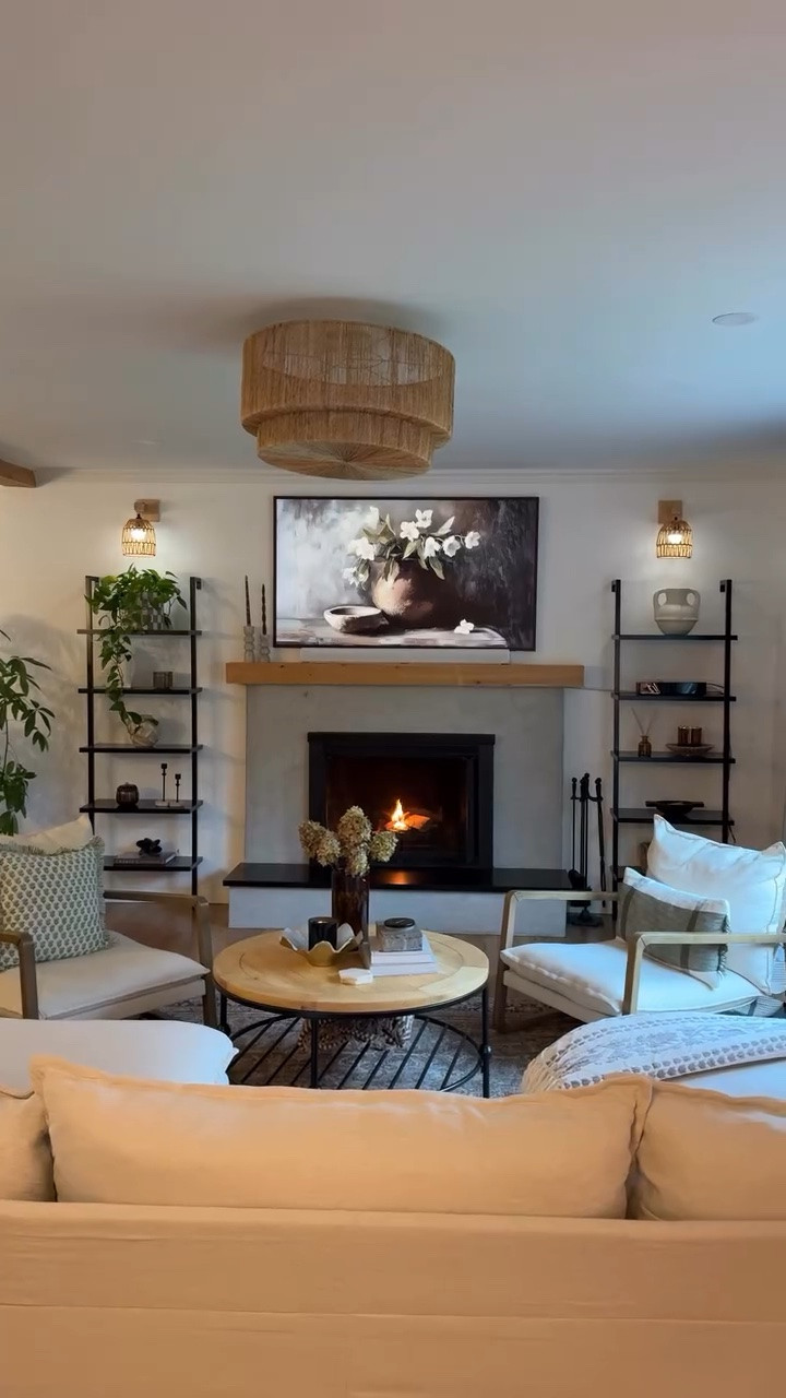 I wasn’t a big fan of the brick 🧱✨ 

During our renovation process, I was told multiple times not to touch the brick around the fireplace, but I didn’t love the color & I didn’t want it painted either. So I did some research and found that we could use micro-cement over the existing brick & we just went for it. Needless to say that to this day, I still love the way the fireplace looks🥰

What do you think of the result? 🤎🍂✨

See anything you like? Comment SHOP for the links 🔗 

#fireplacemakeover #cozyaesthetic #cozylivingroom #brickfireplace #cozyhomedecor