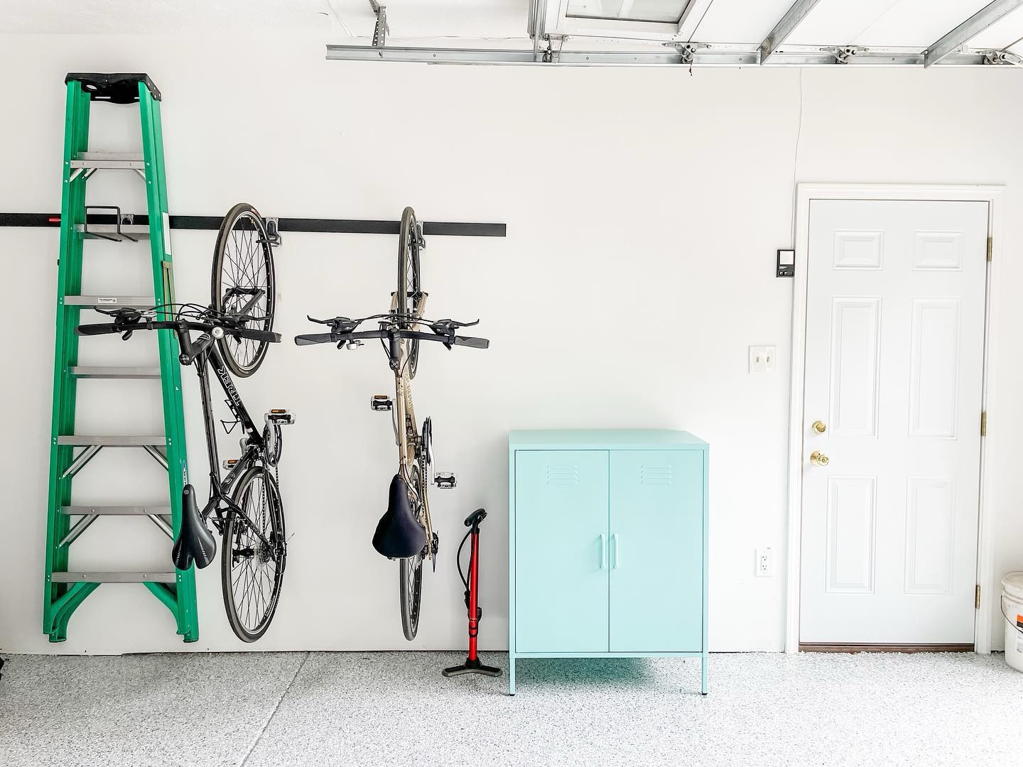 Are we sick of garage photos yet?! 

One of the best kept secrets when it comes to affordable garage storage solutions is the @rubbermaid FastTrack system.

This entire system was under $300 (tracks and hooks and all)! Existing @target shelves were repurposed, with the exception of that cutie patootie MINT storage cabinet from @thenovogratz, perfect for grill tool storage!