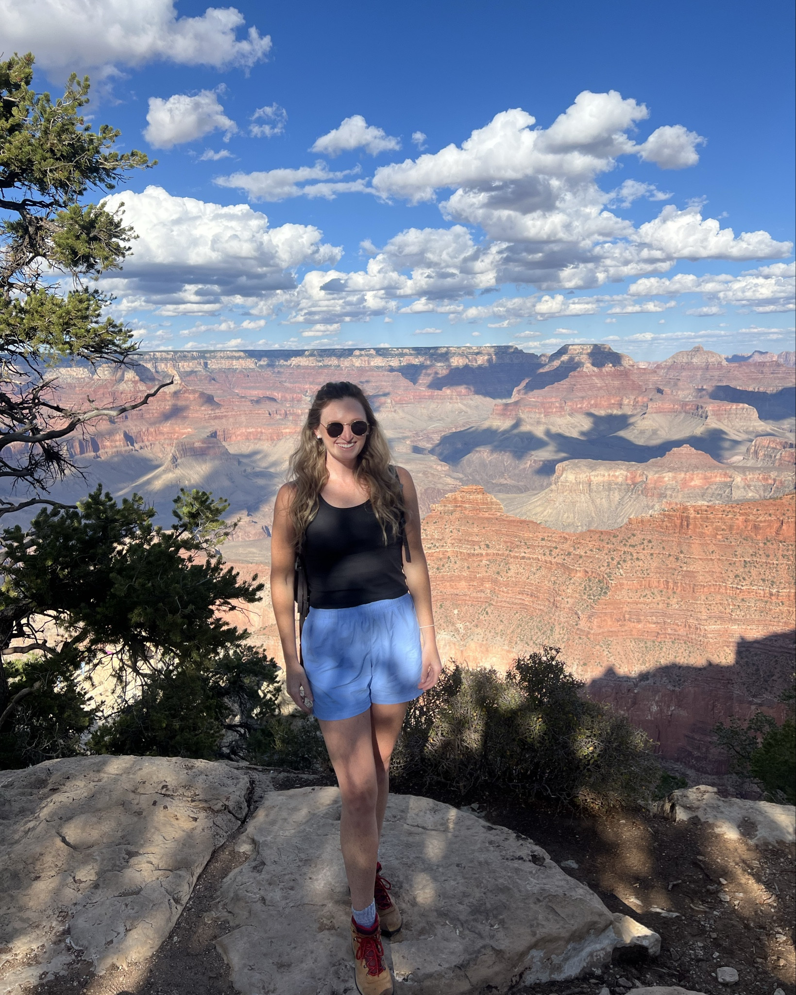 Affordable fall transition hiking outfit. Grand canyon outfit. Blue lightweight active shorts, black lulu dupe workout tank (sized up to L), black active long sleeve layer (not pictured,sized up to L), comfortable hiking boots 

#LTKActive #LTKTall #LTKTravel