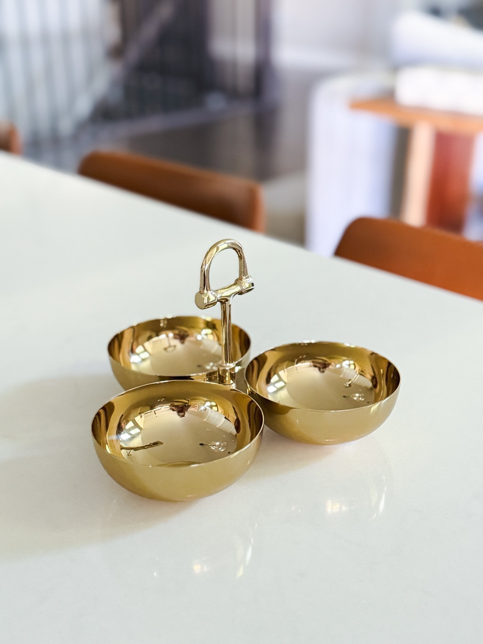 A little gold moment for the kitchen. This equestrian-inspired trio serving set is one of those pieces that feels collected, timeless & a little unexpected. Crafted from polished brass & stainless steel with three bowls & a beautiful center handle, it’s perfect for olives, nuts, dips, candies or little snacks. I love it styled on a bar cart or countertop just as much as I do for entertaining.

equestrian home decor - equestrian serving set - horse bit decor - gold serving dish - brass serveware - three bowl serving set - condiment serving set - appetizer bowls - dip serving bowls - nut bowl - olive dish - cocktail hour essentials - bar cart accessories - entertaining essentials - hosting essentials - dinner party decor - tabletop decor - elevated kitchen decor - luxury home accessories - traditional home decor - timeless home decor - hostess gift - housewarming gift

#LTKHome #LTKU #LTKdayinmylife