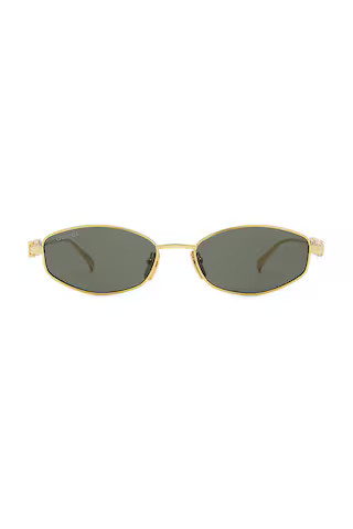 Gucci Oval Sunglasses in Gold & Grey from Revolve.com | Revolve Clothing (Global)