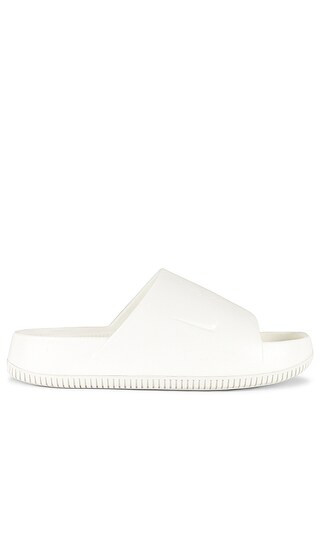 Nike Calm Slide in White. - size 9 | Revolve Clothing (Global)
