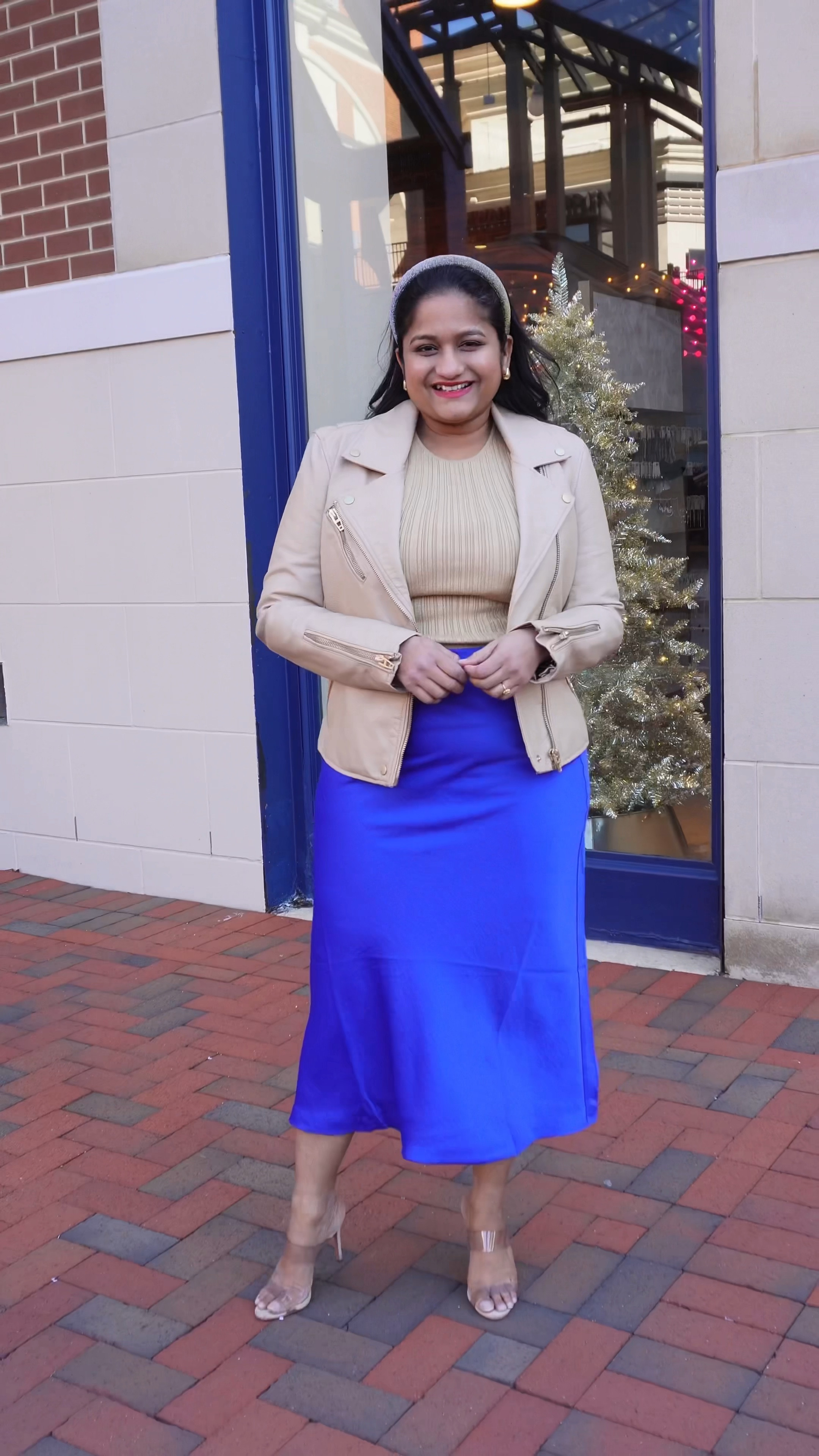 Winter chic outfit idea. @loft satin skirt in blue color, wearing size 
@madewell shimmer knit tank 
@blanknyc faux leather jacket 
@schutz heels 

#LTKSeasonal #LTKmidsize #LTKfindsunder50