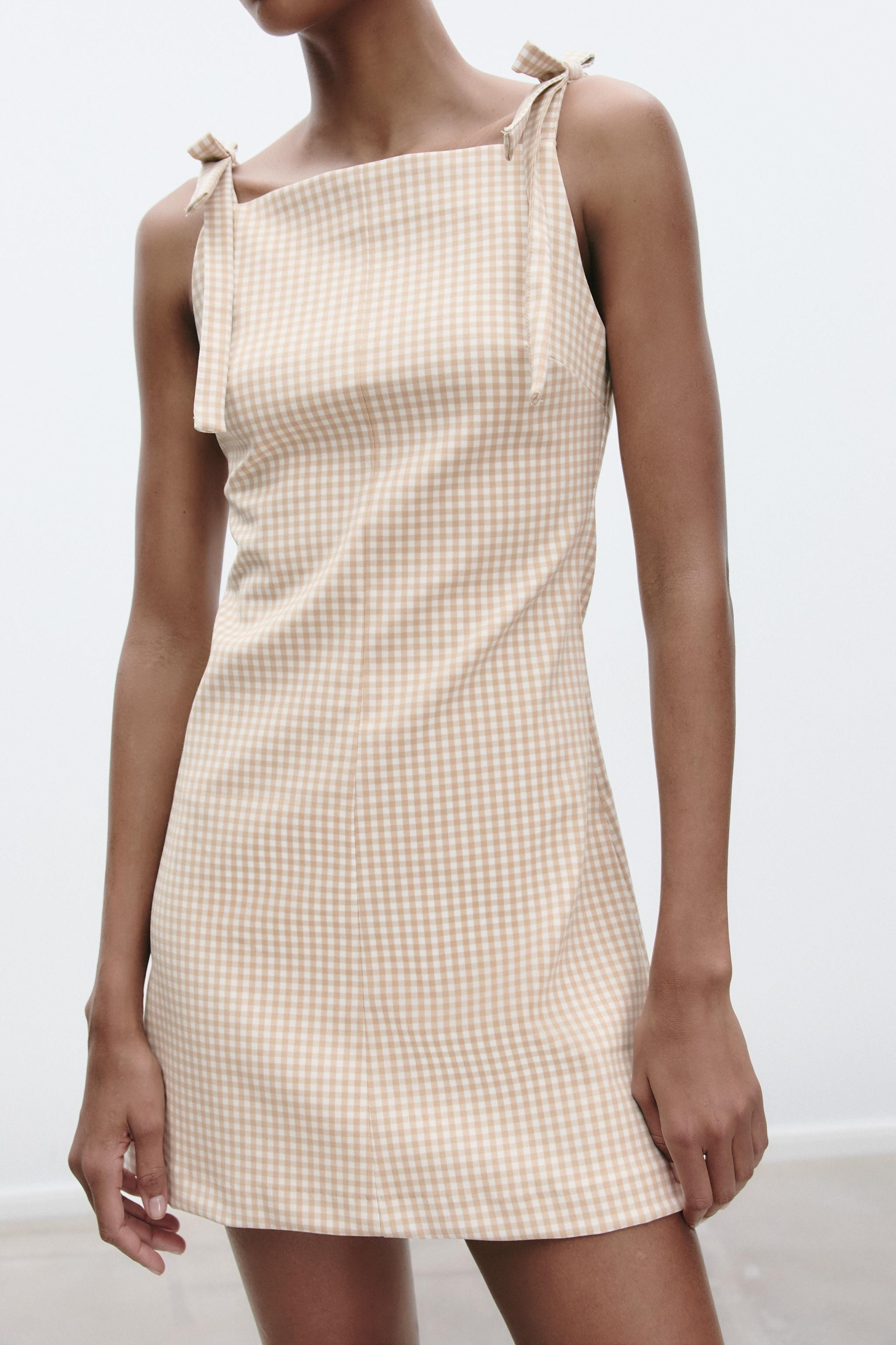 Short dress with straight neckline and straps with bow detail. Matching interior lining. Hidden i... | Zara US
