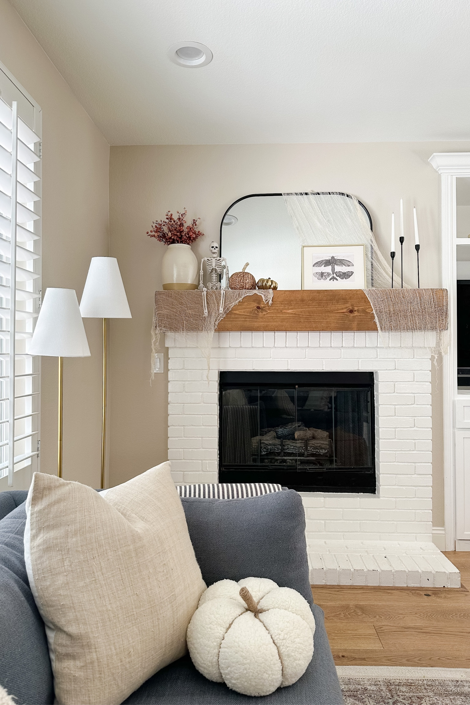 Fall mantel, Halloween mantel, skeleton, pumpkins, beige creepy cloth, beige cheese cloth, faux fall florals.

#LTKsalealert #LTKHalloween #LTKhome