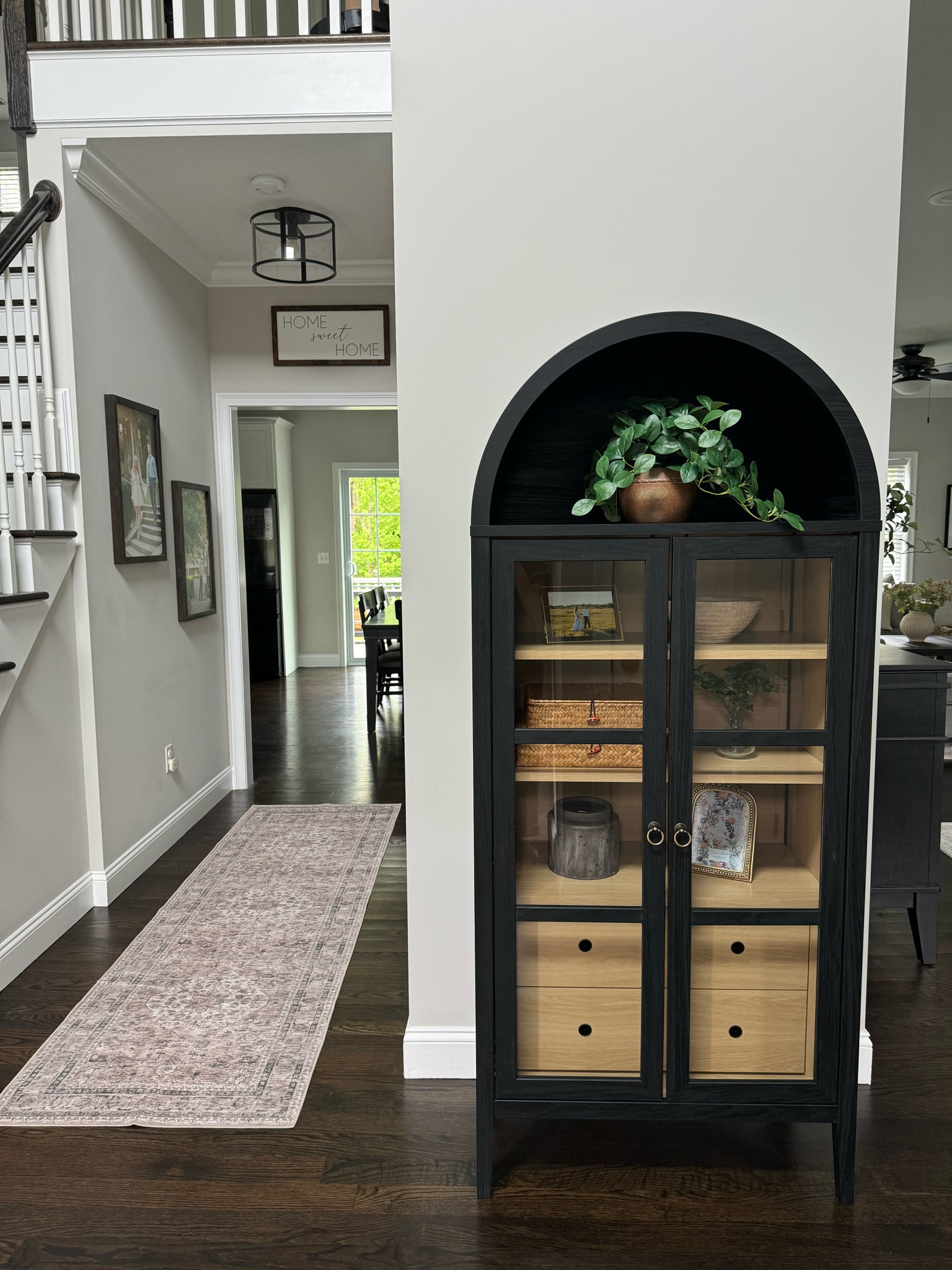 Tall, black arch cabinet with the designer look, without the designer budget! 

#LTKHome #LTKFamily #LTKSaleAlert