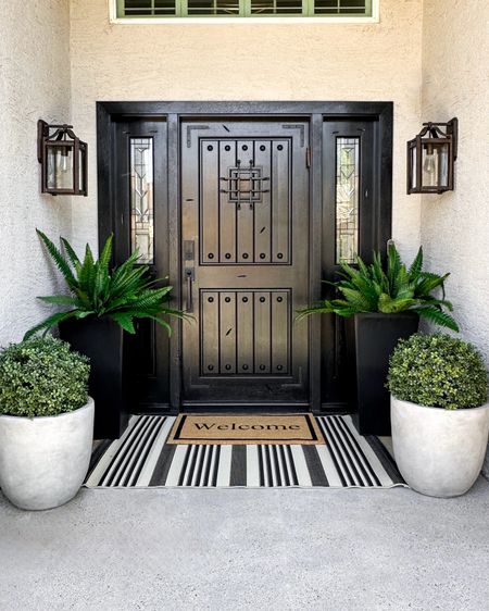 Front porch redo…all Amazon
Hello all faux plants🙌🏻 so over buying new plants for this space! I absolutely love it!! I have these topiaries at my Flag house as well…the best size and they stay beautiful!
Front door refresh, front patio porch decor 
Outdoor planters and faux plants, welcome mat and outdoor rug modern stripe

#LTKHome #LTKStyleTip #LTKFindsUnder100