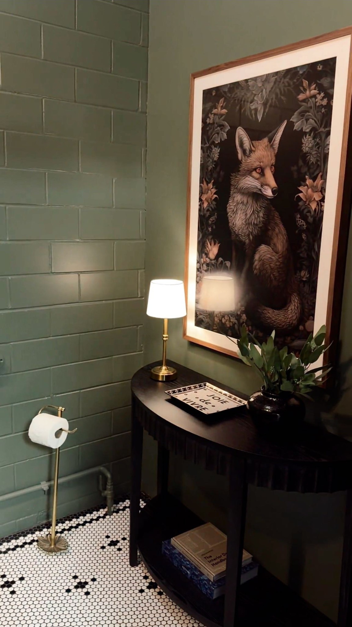 Bathroom transformation—before and after! I still can’t believe it’s the same space. I wanted a dark, moody vibe, and it turned out perfect. We love the deep green walls, black vanity, and intricate flooring.

Comment BATHROOM and I’ll send you links to everything I used to create this magical space! My favorite detail? The William Morris inspired fox art print. 🦊✨

#bathroominspo #bathroom 
#bathroomdesign #foxart #bathroominteriordesign #bathroomremodel