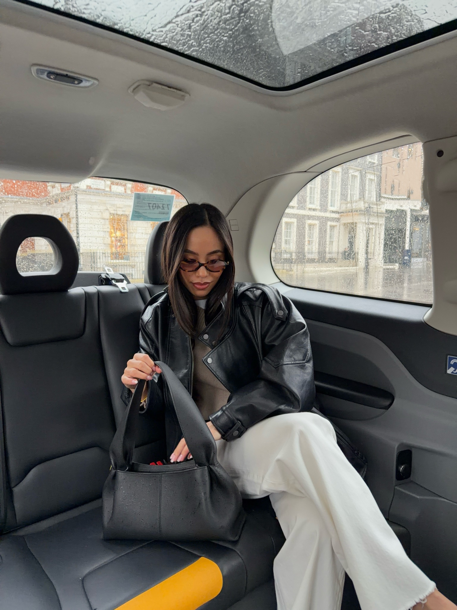 Your most loved autumn outfits 🍂 oversized black leather biker jacket, v neck jumper and tee with barrel leg white jeans and Polene bag. Autumn city rainy day outfit inspo

#LTKautumn #LTKFashionMonth #LTKjeans