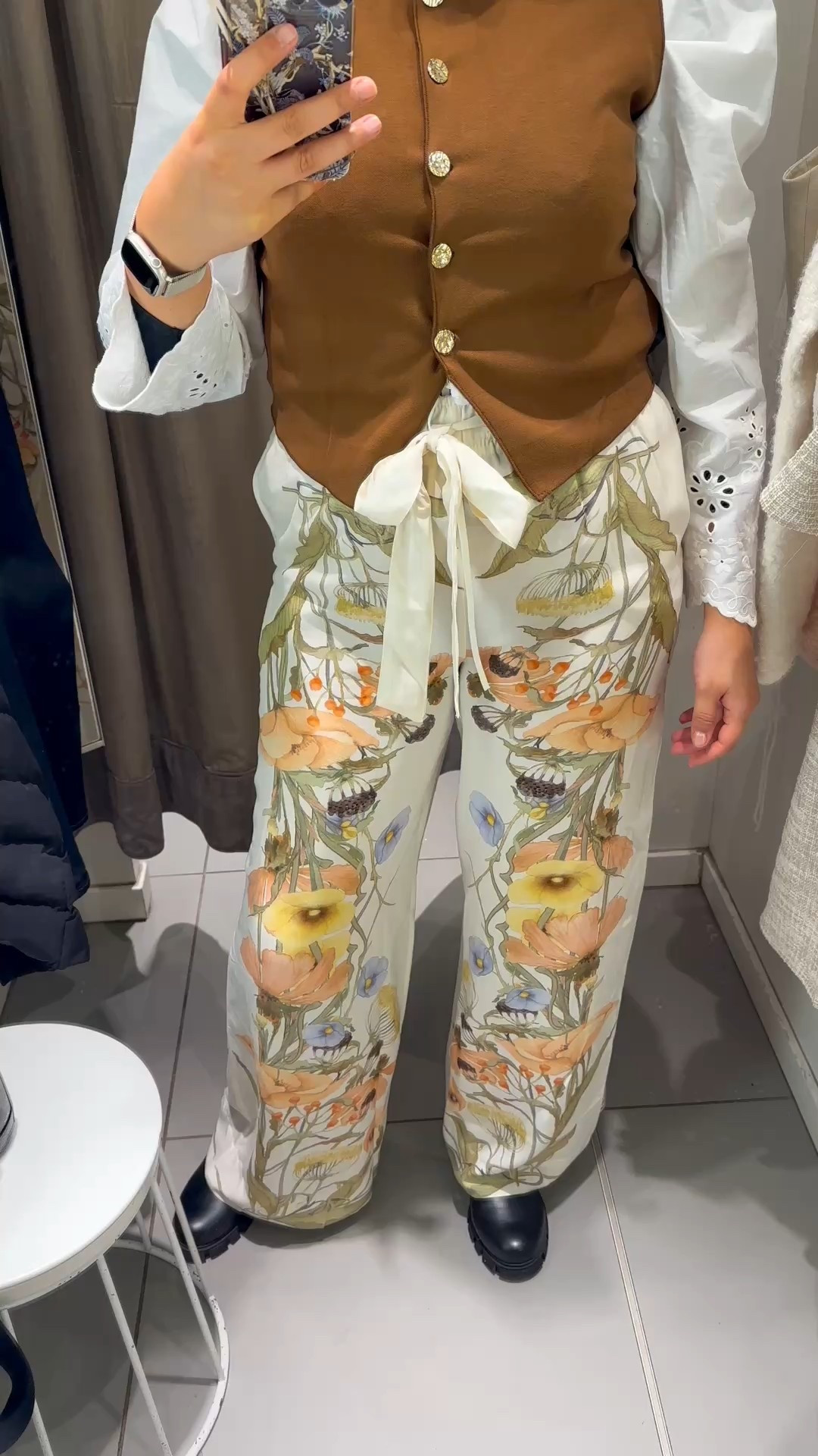 “Reference: Gilet M trousers L" 
This set is giving all the sophisticated spring vibes! 🌿✨ The gilet is a classic piece—structured, warm enough for this transitional weather, and those gold buttons add a luxurious touch. I styled it with a white shirt, but you can easily swap it for a simple t-shirt for a more relaxed look.

And let’s talk about these trousers… they are everything! Made from soft viscose, they drape beautifully and feel incredibly light on the skin. The floral print is so dreamy, perfect for spring and summer. However, it is a little bit see-through, so be mindful of what you wear underneath!

Would you style this set the same way or mix it up? Let me know! 🖤

#LTKeurope #LTKspring #LTKFashionMonth