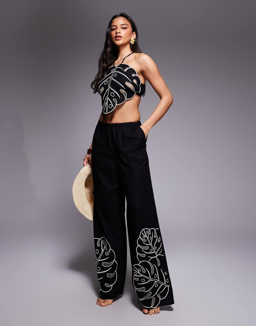 ASOS DESIGN Jasmine tropical cut out beach pants in black | ASOS (Global)