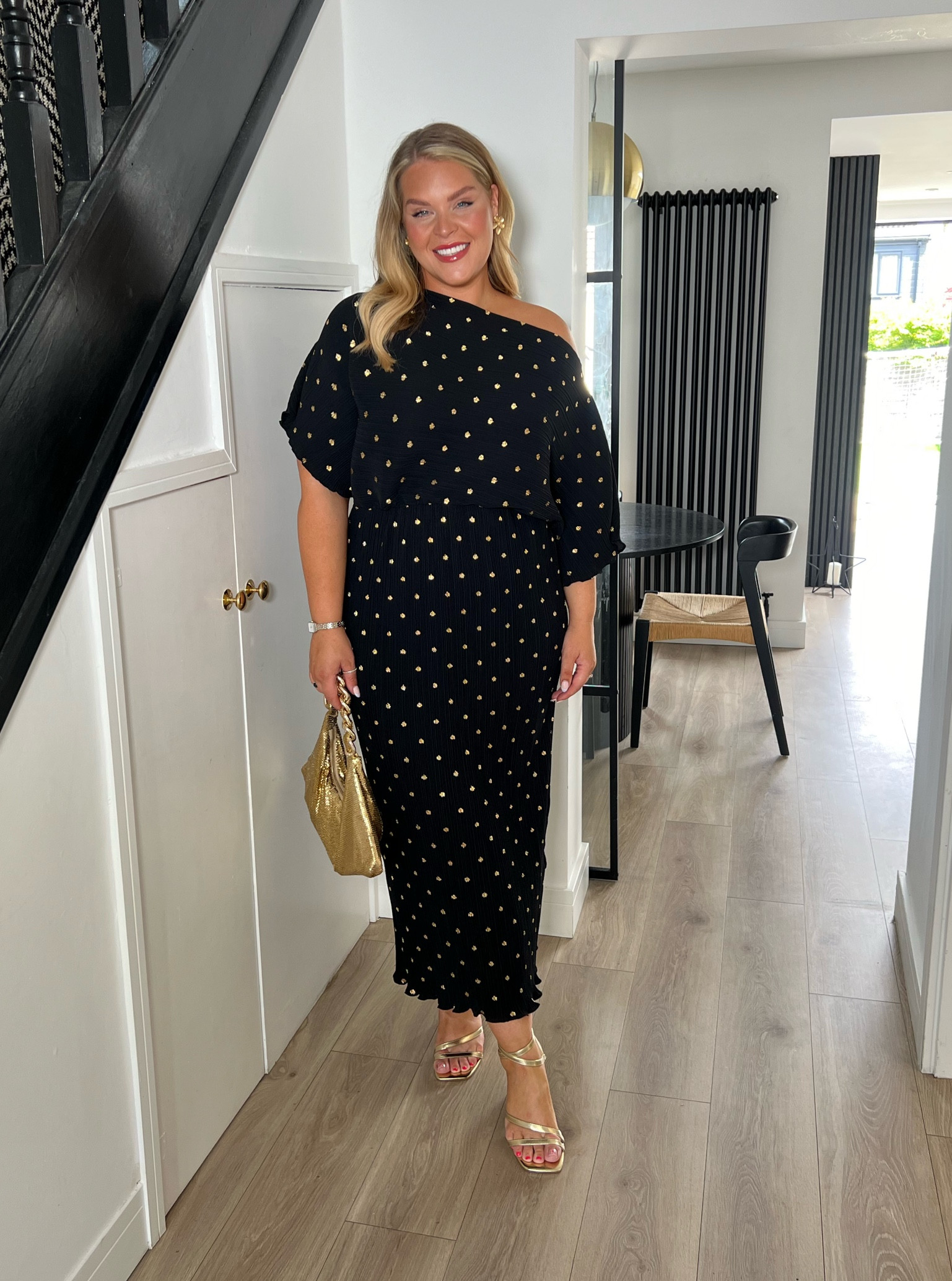 Wedding guest dress. Occasion wear. Races outfit. Plisse dress. Black and gold dress. Never fully dressed. Gold bag. Comfy shoes. Gold shoes. 

#LTKeurope #LTKcurves #LTKwedding