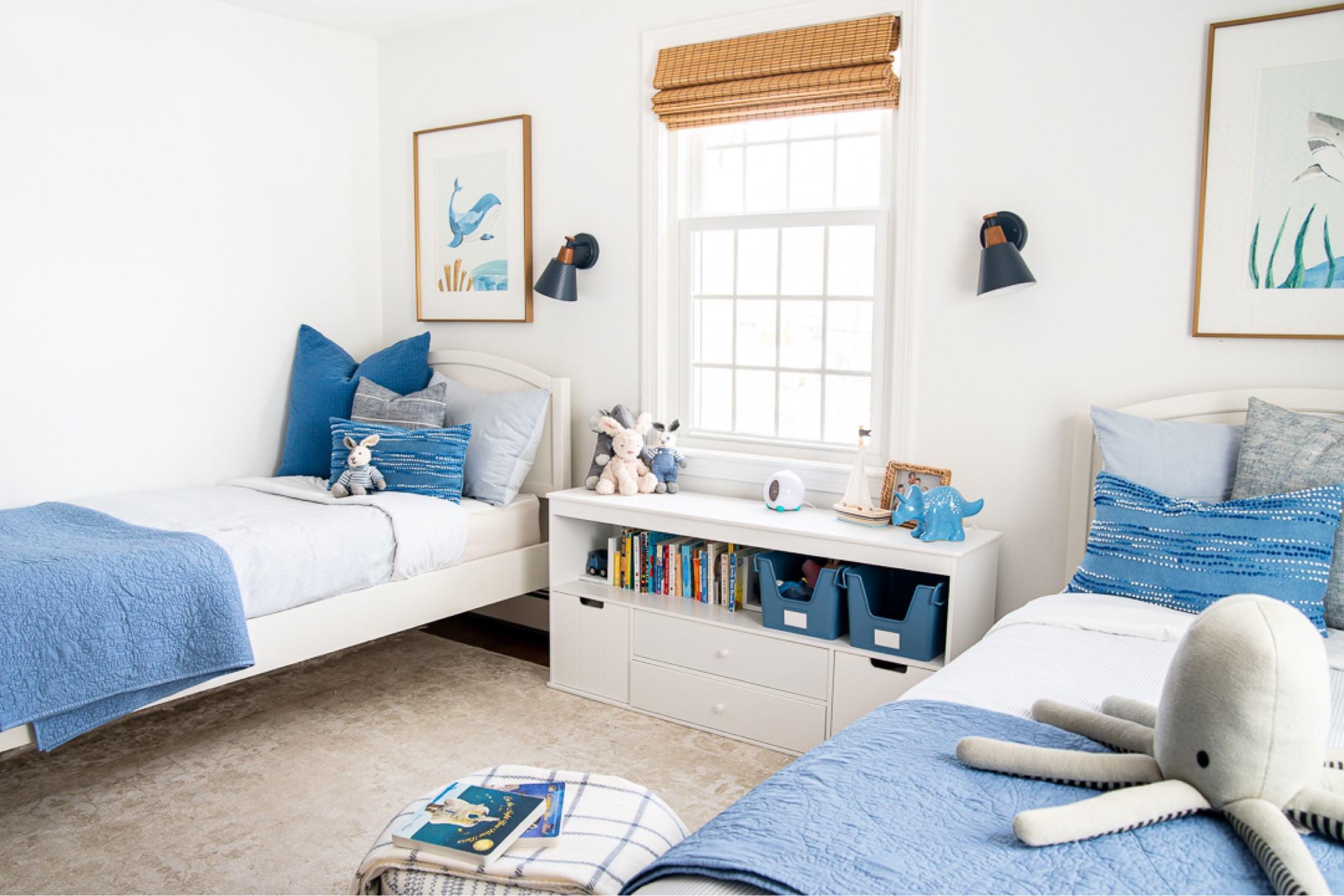 Little boy bedroom! My son recently moved from a crib to a bed and so his bedroom got a fun refresh. I added two twin beds, lots of touches of blue and some fun artwork over the bed. 

#LTKhome #LTKkids #LTKfamily