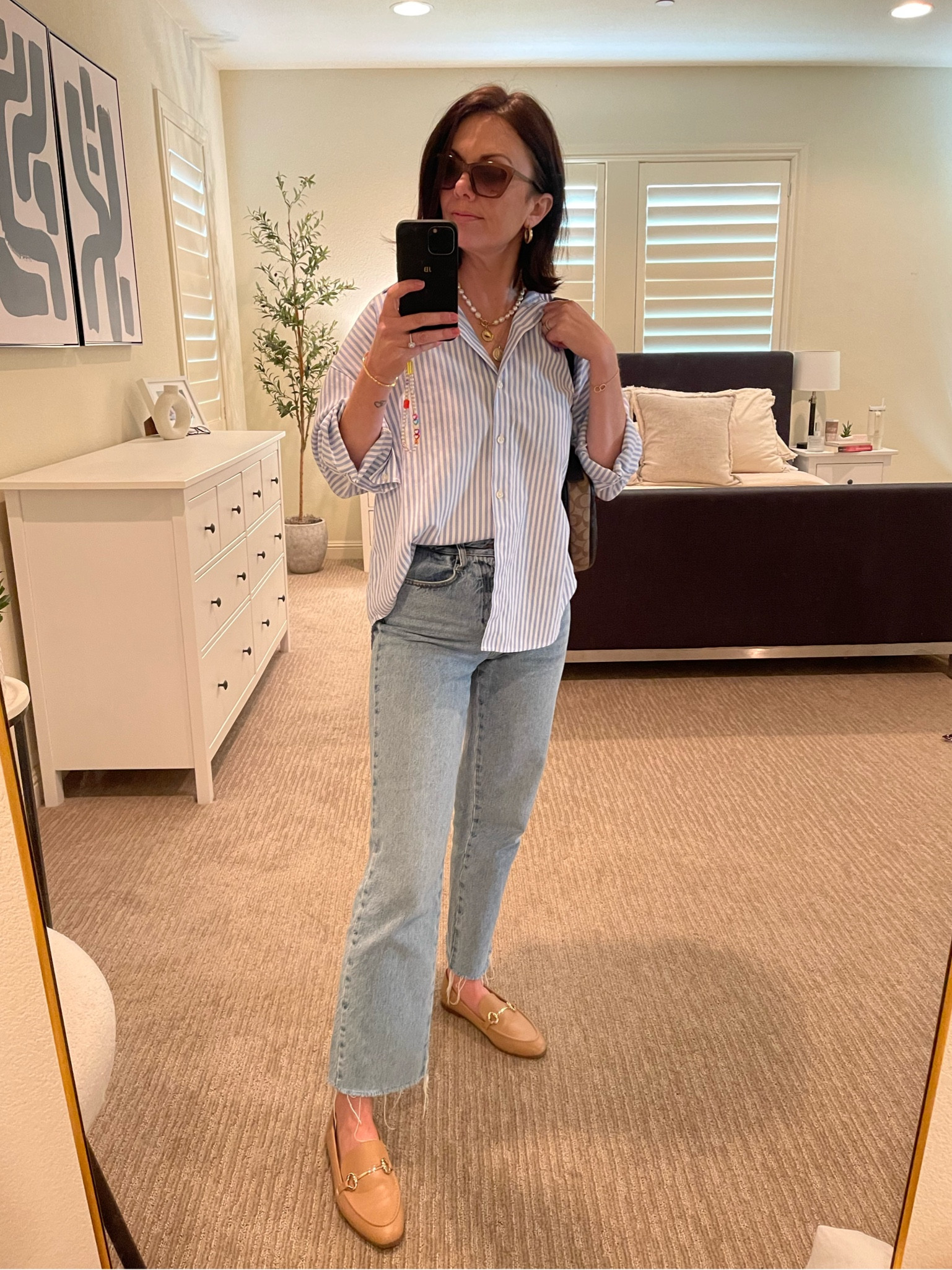 Casual and Chic 
Blue and white button down (essential for fall capsule wardrobe ) 
Blue straight jeans, beige loafers, coach bag,  French connection sunglasses and gold accessories to finish off 

#LTKshoecrush #LTKSeasonal #LTKstyletip