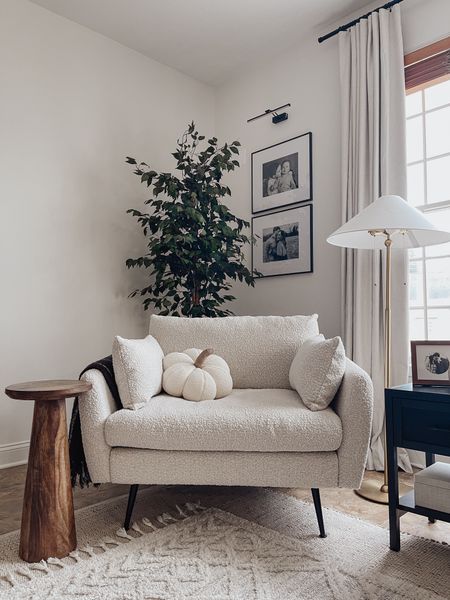 Such a beautiful accent chair. Everyone in the family loves snuggling up on it. 

Accent chair, boucle chair, side table, drink table, TJ Maxx find, target home, floor lamp, living room decor, wall frames, picture frame light, focus tree, faux tree, jute rug, area rug, affordable rug, neutral home, neutral decor

#LTKstyletip #LTKhome