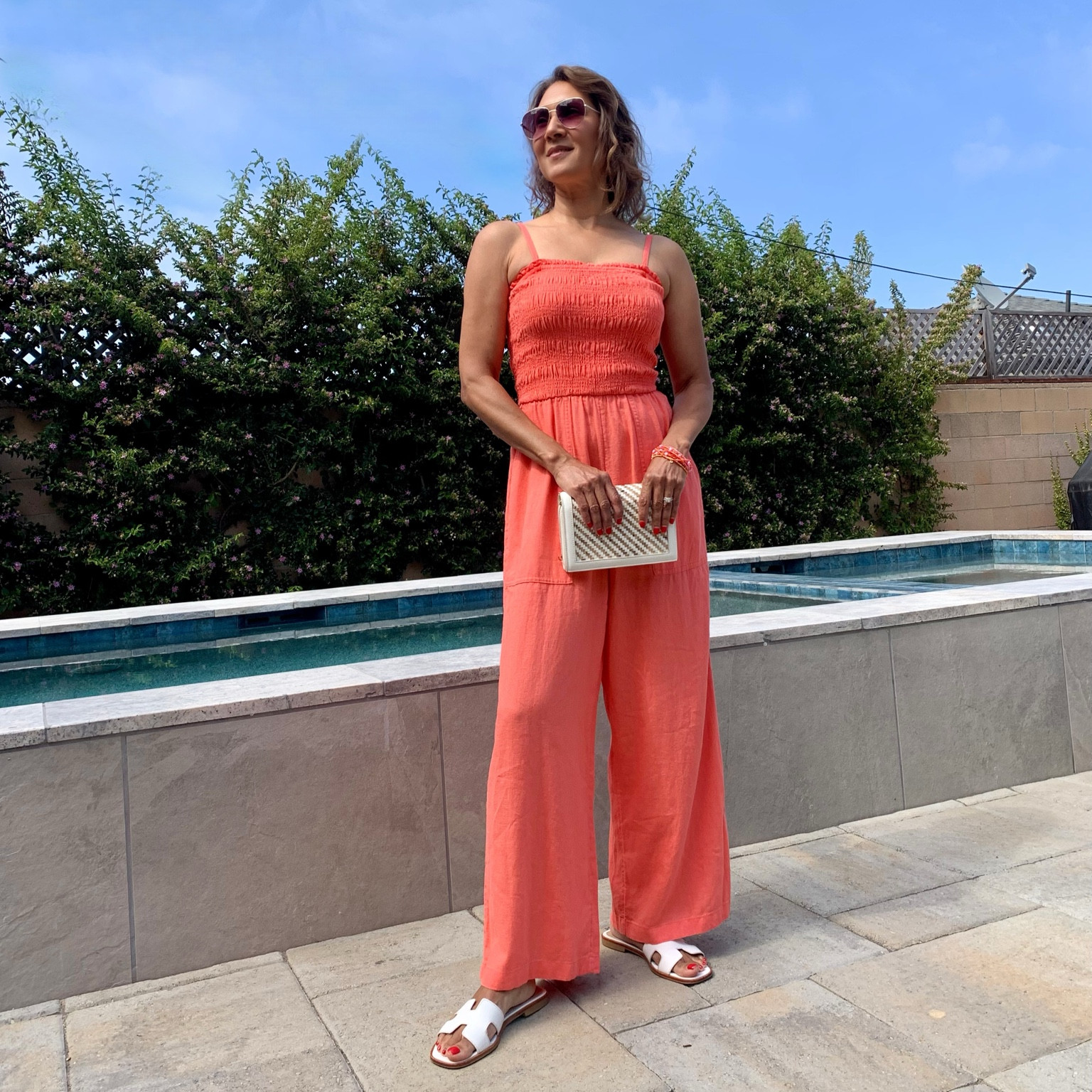 Affordable summer outfit idea! How cut is this smocked maxi jumpsuit!?! It’s a cute vacation outfit, and also sweet for brunch with the besties. Style with a little white clutch, bracelets, and white flats.

#LTKStyletip


#LTKOver40 #LTKSeasonal #LTKSummerSales